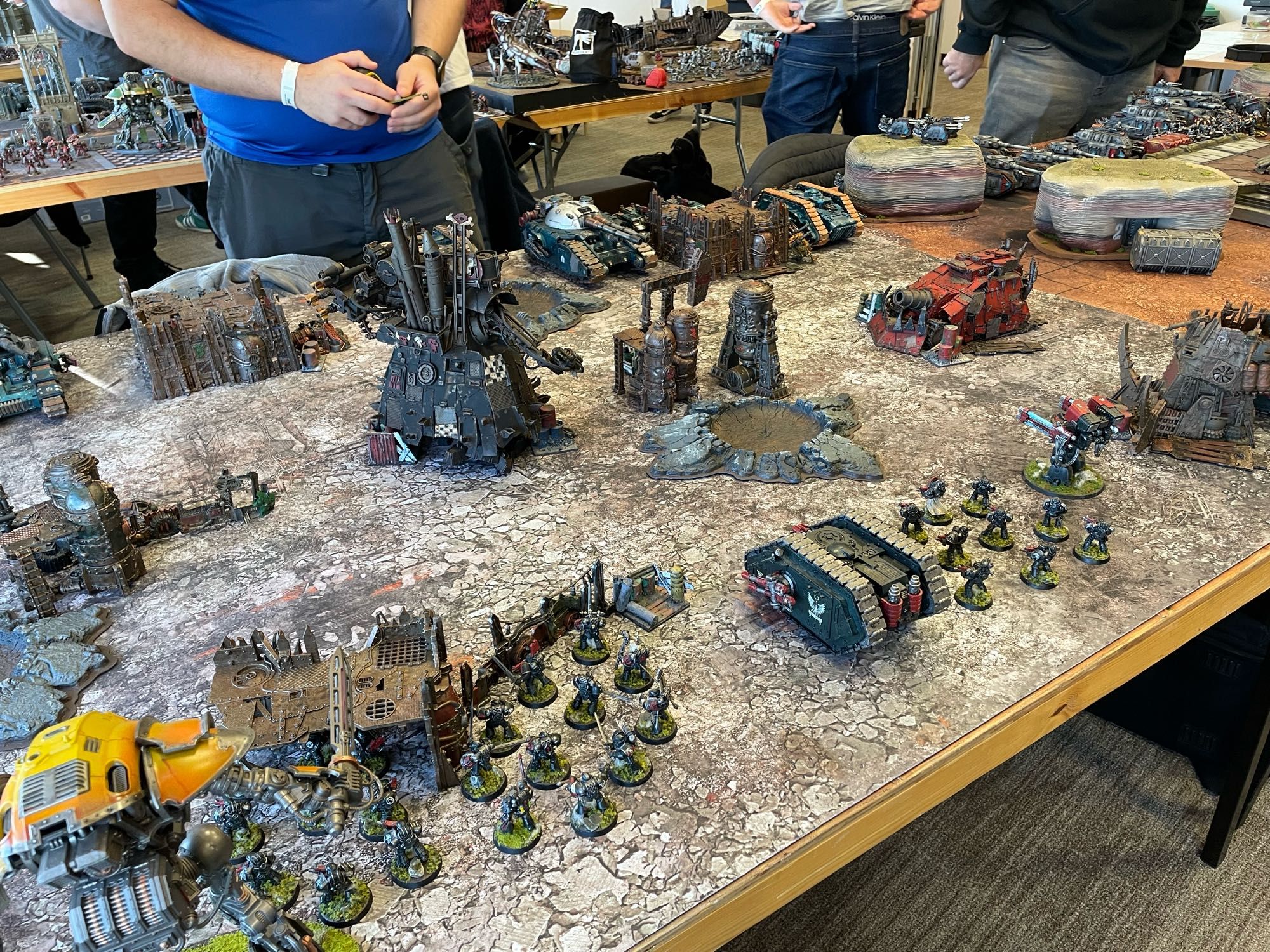 Two Horus Heresy armies lined up for a game, Dark Angels closest and Alpha Legion in the background