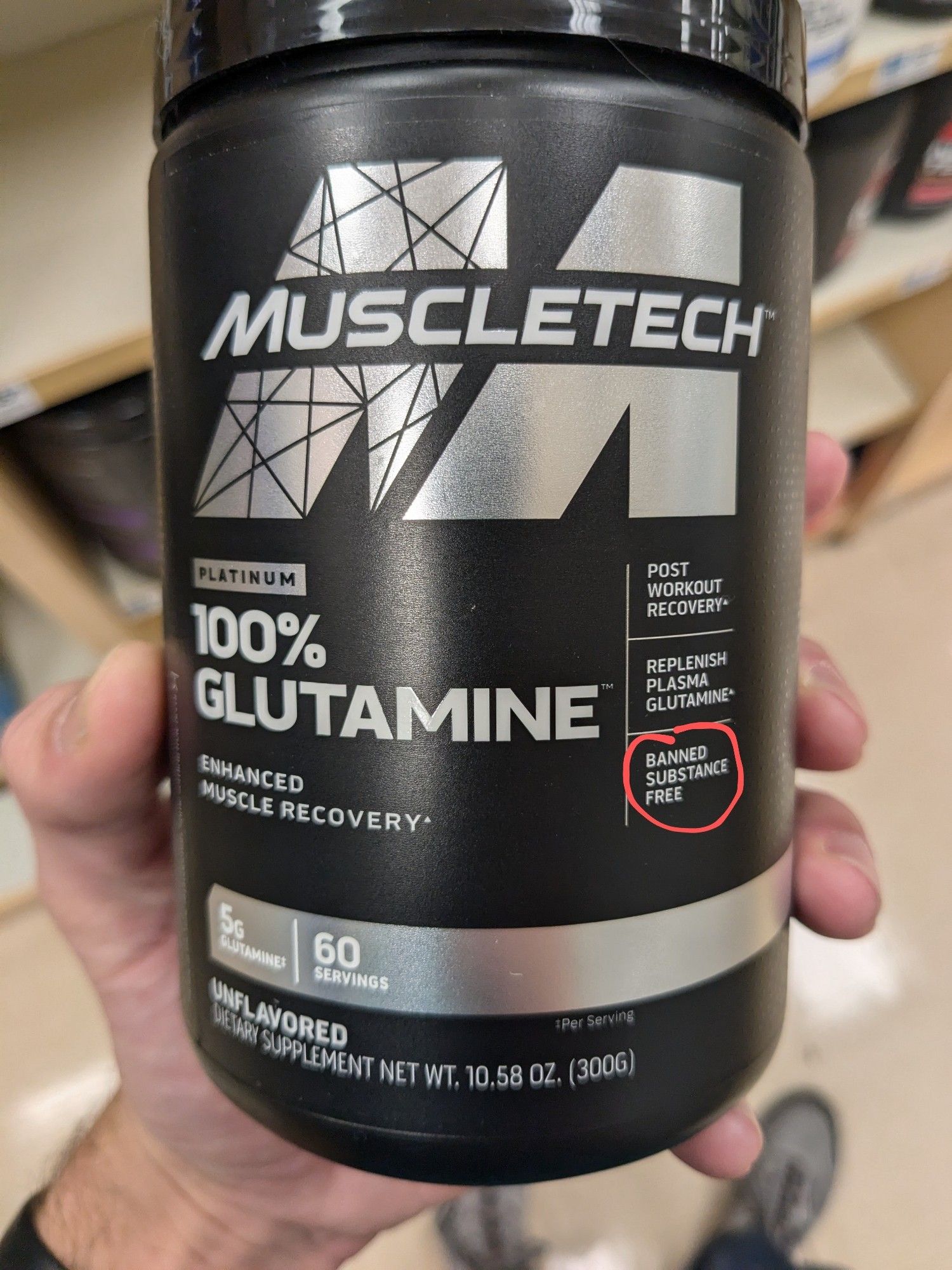 Muscletech bottle, 100% Glutamine. on the right in a red circle reads, "banned substance free"