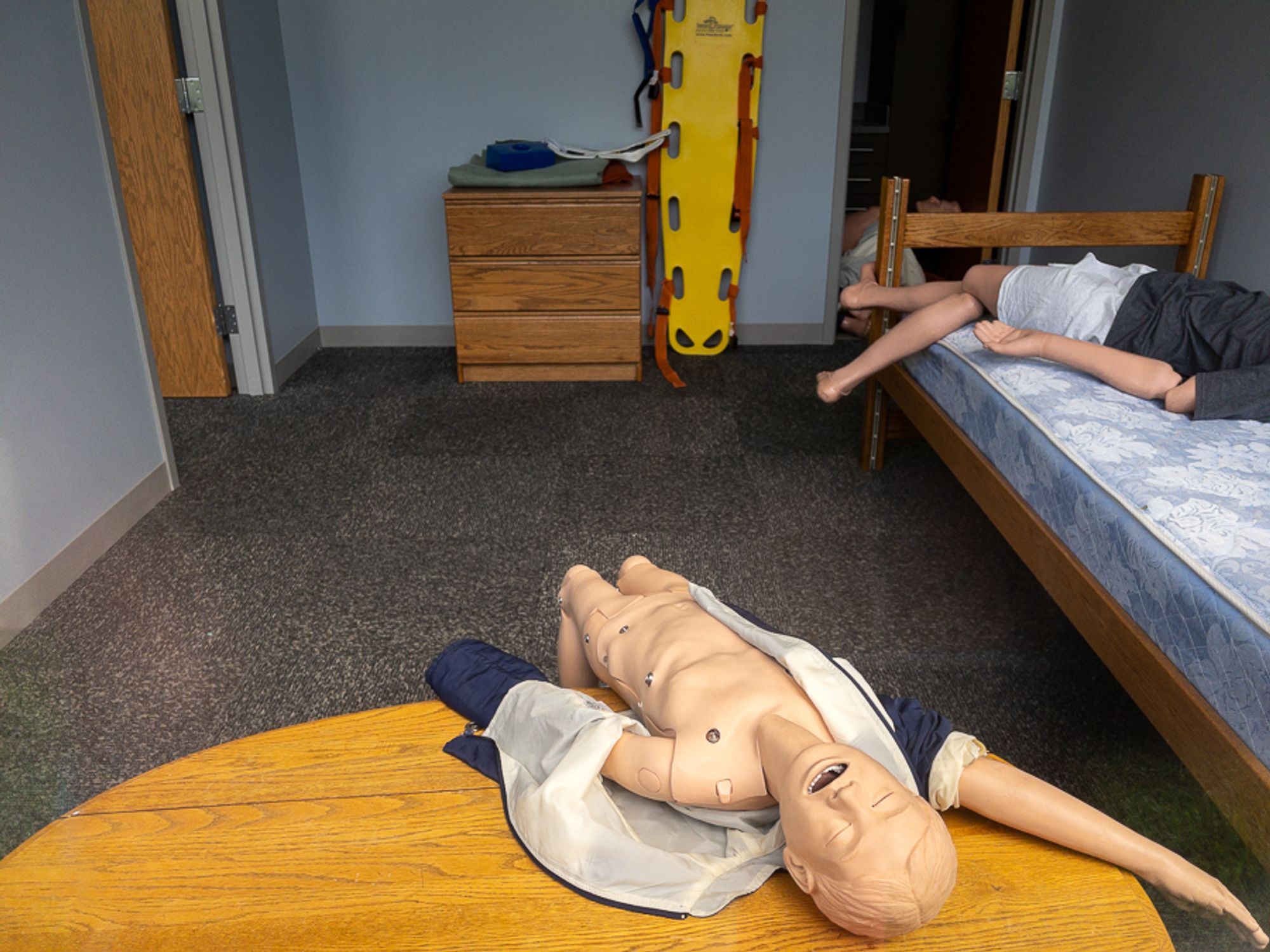 emergency training dummies laid out in a room nightmarishly