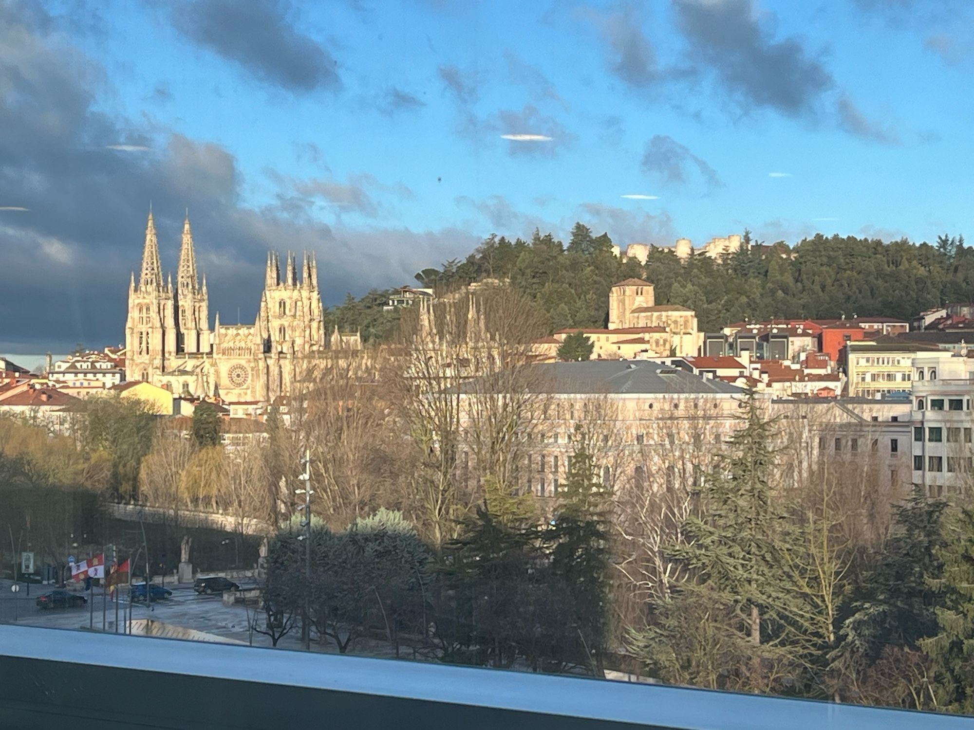 Scenic view of the Burgos castle and cathedral against a partly cloudy winter sky