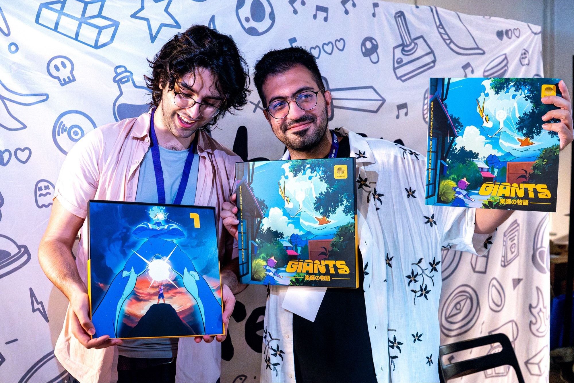 A photo with the creative director of our mega-album GIANTS, Mohammed Taher, alongside art director & designer Caspian Whistler in their first time opening and flipping through the vinyl album that they designed together.