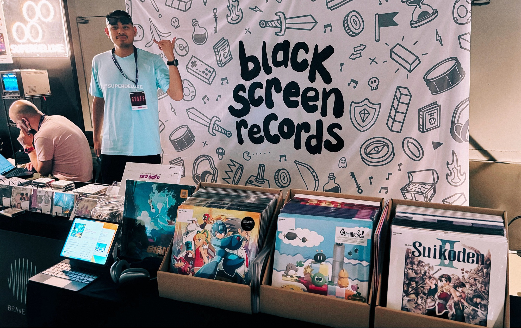 Brave Wave CEO Alexander Aniel at the Black Screen Records booth.