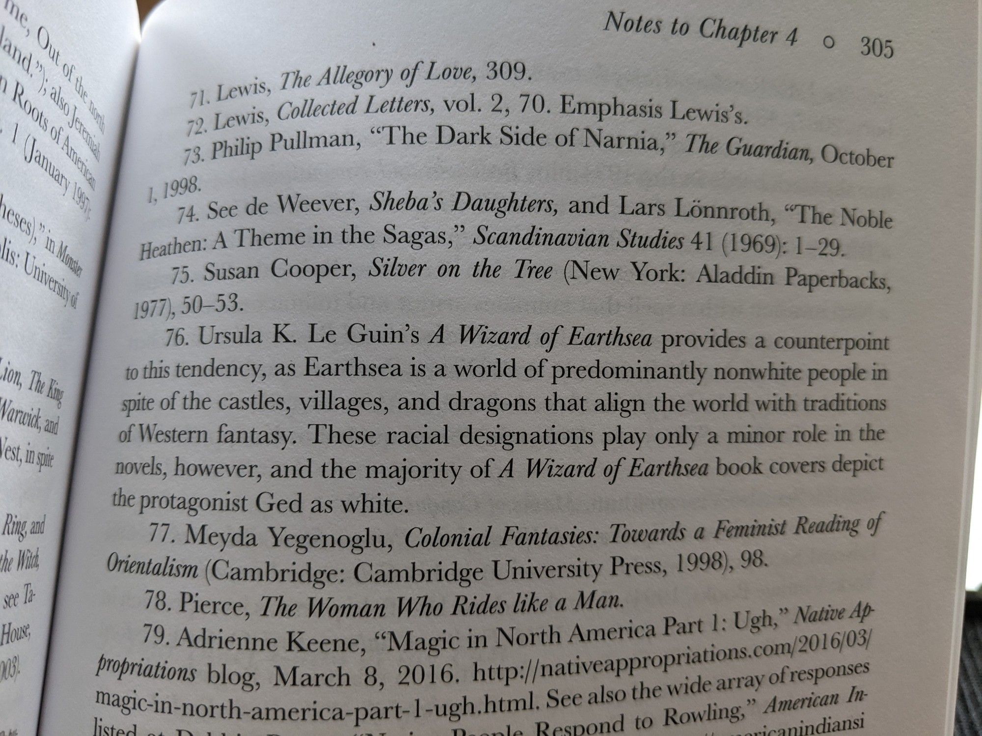 Photo of p. 305 in Re-Enchanted: The Rise of Children's Fantasy Literature in the Twentieth Century by Maria Sachiko Cecire. Note 76 reads: "Ursula K. Le Guin's A Wizard of Earthsea provides a counterpoint to this tendency, as Earthsea is a world of predominantly nonwhite people in spite of the castles, villages, and dragons that align the world with traditions of Western fantasy. These racial designations play only a minor role in the novels, however, and the majority of A Wizard of Earthsea book covers depict the protagonist Ged as white."