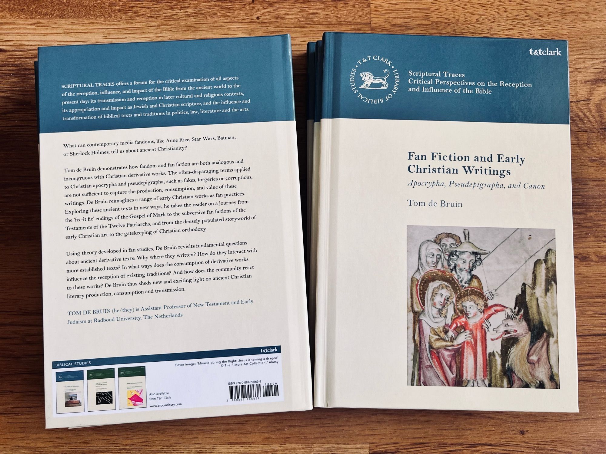 Photo of covers of a book “Fan fiction and Early Christian Writings” by Tom de Bruin. The cover has a picture of a sassy Jesus petting a dragon.