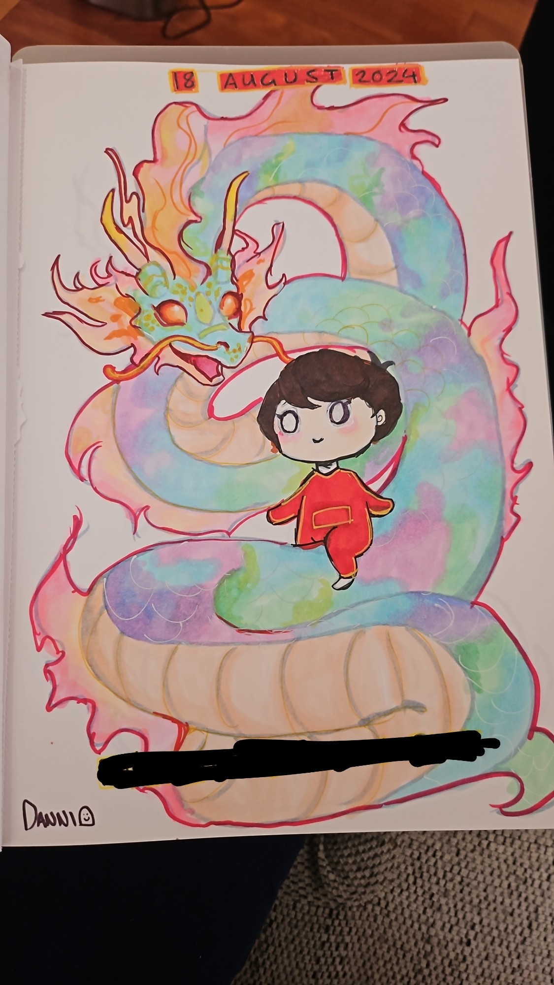 Traditional art using alcohol markers of a baby boy rising a pastel coloured dragon. There is a streak of black at the bottom to remain anonymous