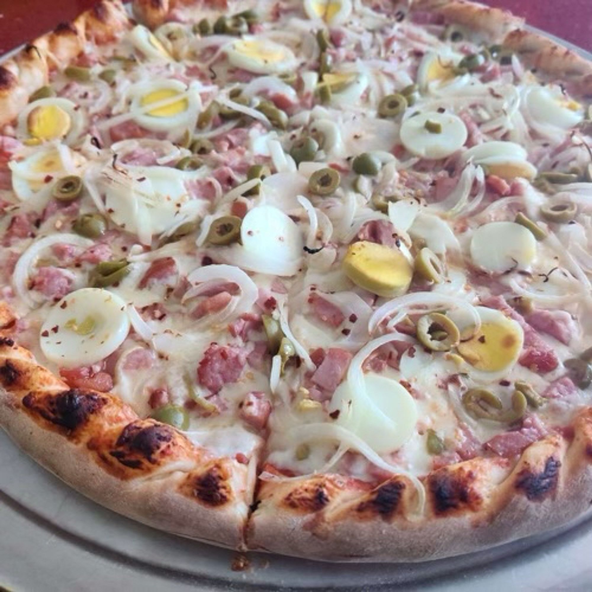 Pizza with boiled eggs