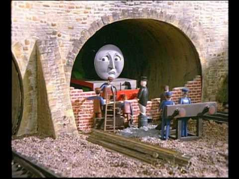 Sir Topham Hatt bricking up Henry the locomotive in a tunnel.