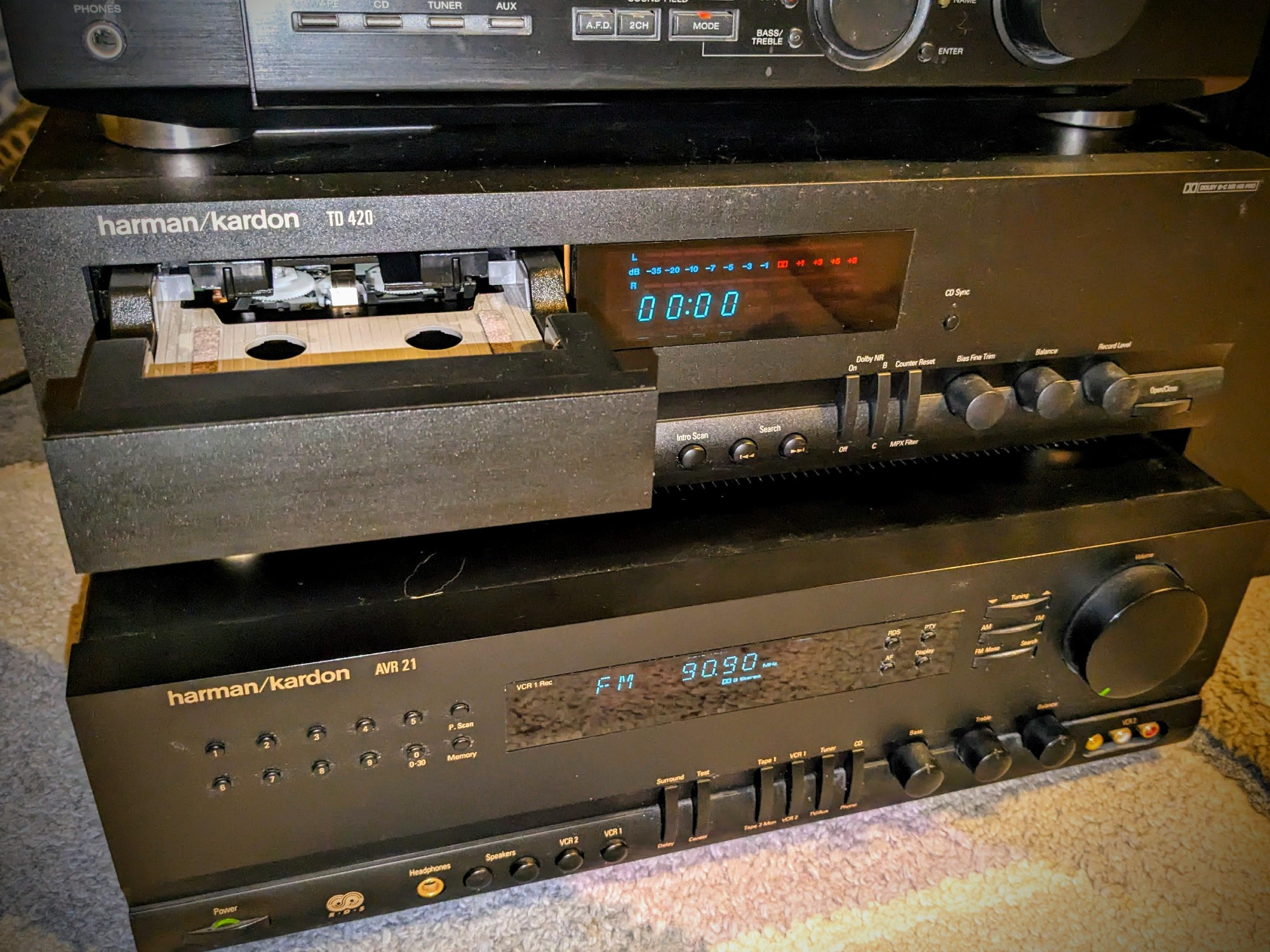 harman/kardon TD 420 tape deck with opened horizontal motorized tape tray, on top of receover AVR 21.