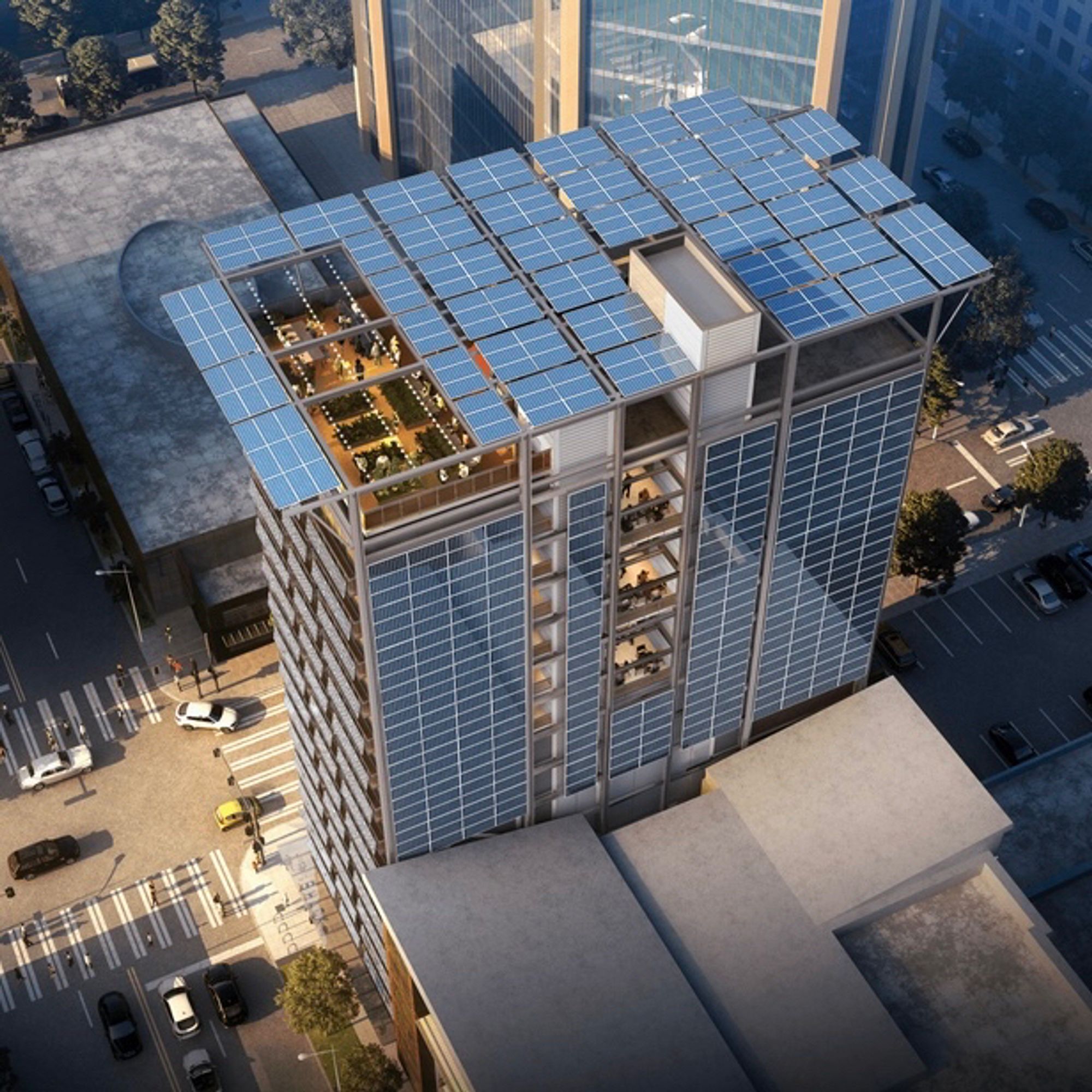 15-story apartment building in downtown Seattle has solar modules that form the guard rails of every balcony and a large solar canopy that extends out from the roof as a contemporary cornice. Seen from above looking down to the street below with a good view of the rooftop solar installation.