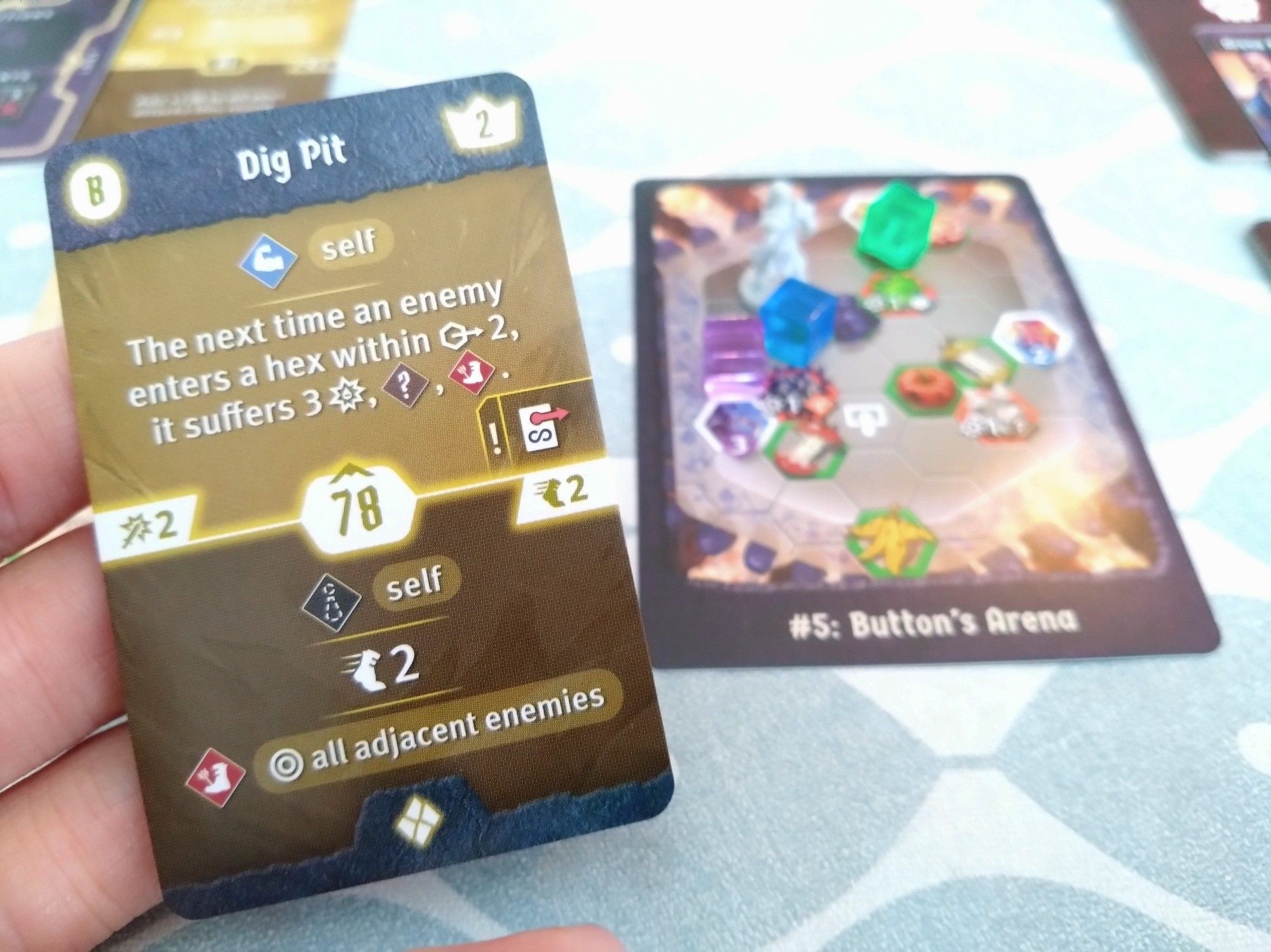 A card with a cool Hex ability, in the background to the right the game board state is shown