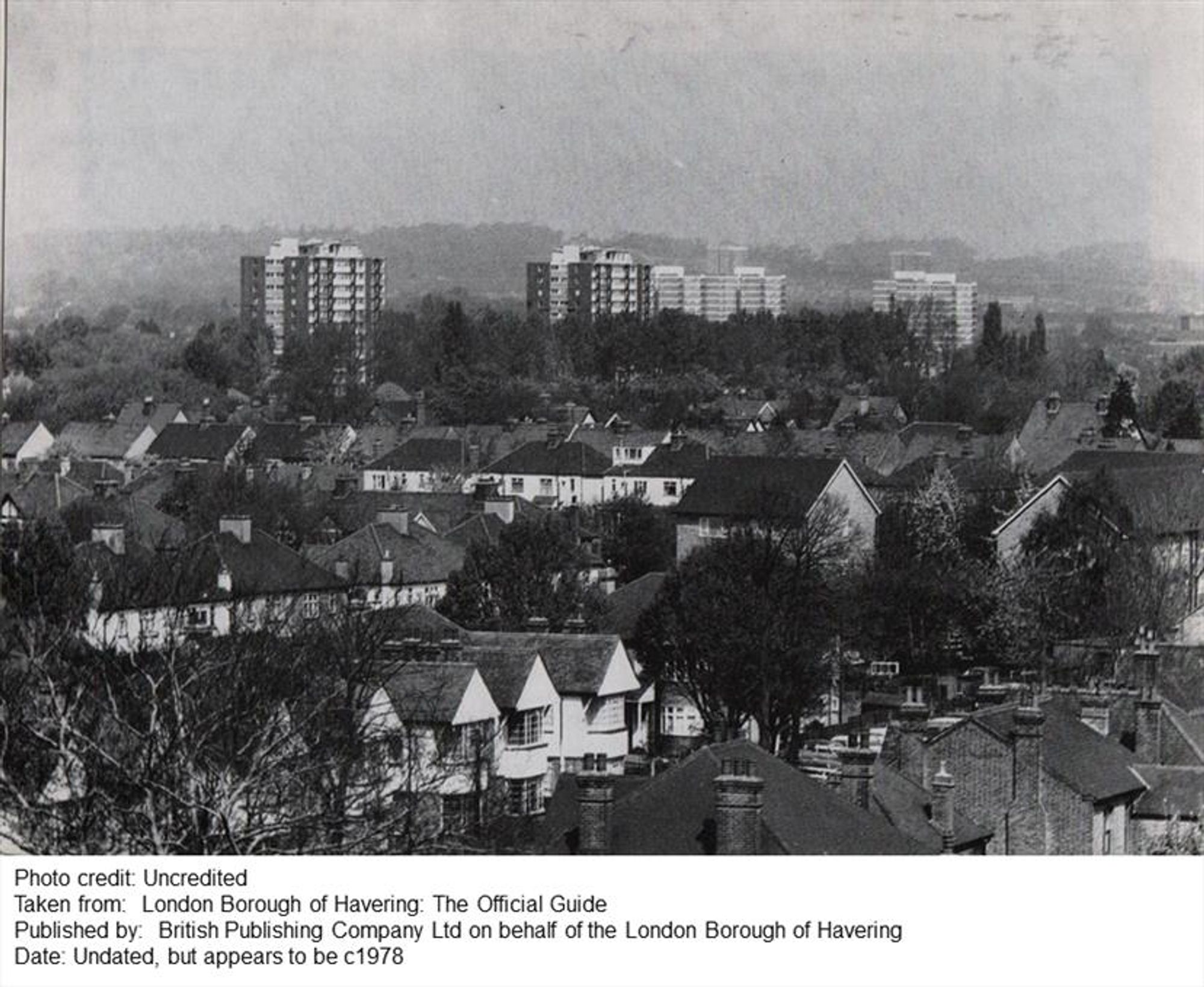 A black and white photo of a view across the roofs of suburban houses in the Borough with residential tower blocks in the distance.

Photo credit: Uncredited
Taken from: London Borough of Havering: The Official Guide
Published by: British Publishing Company Ltd on behalf of the London Borough of Havering
Date: Undated, but appears to be c1978