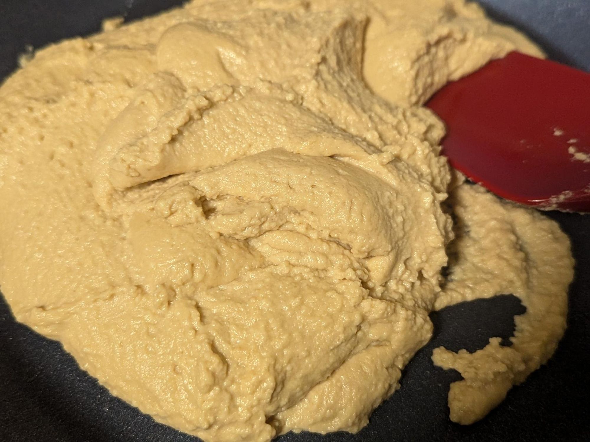 Pale brown makha sandesh in a pan