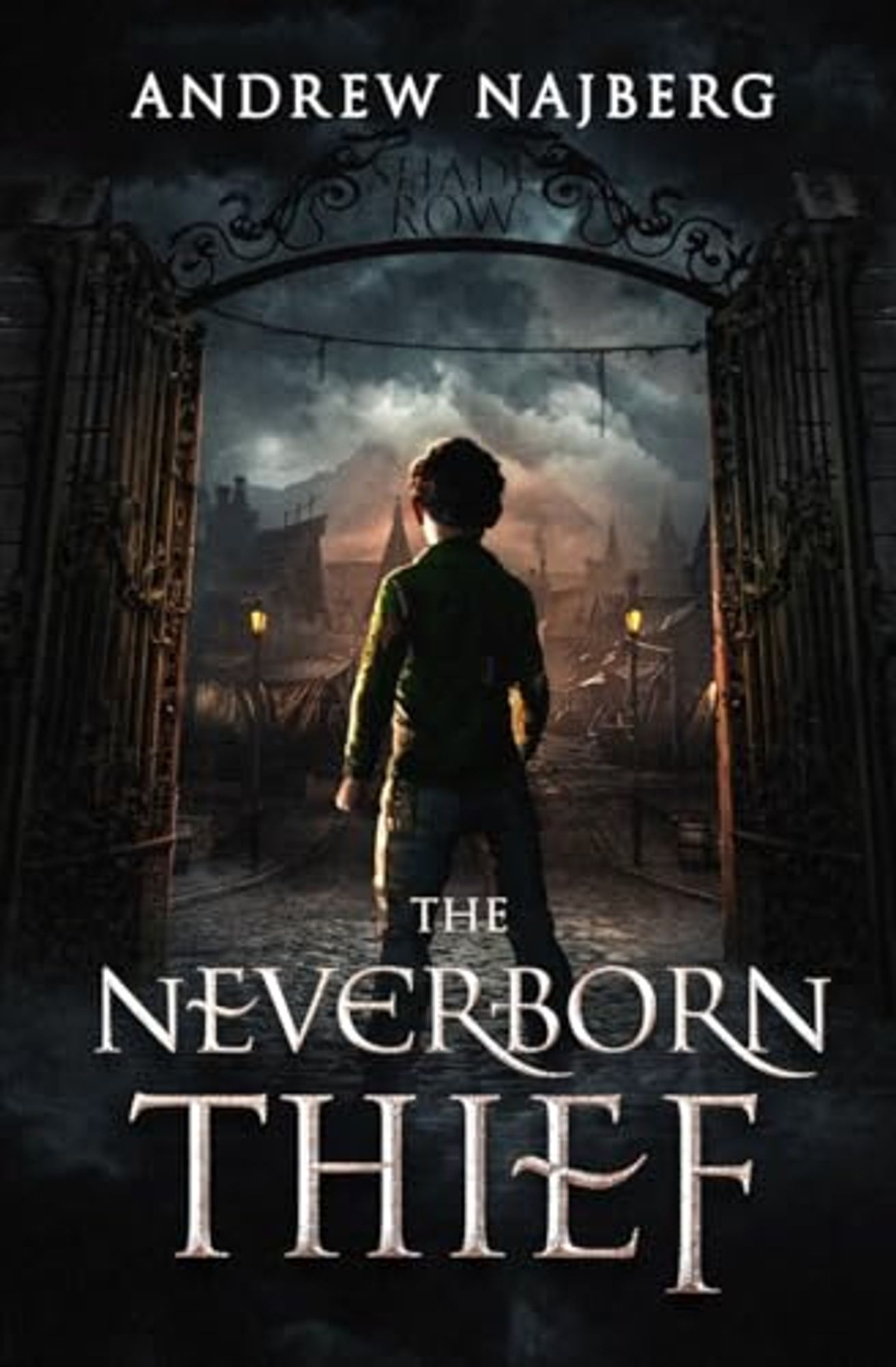 Book cover for The Neverborn Thief by Andrew Najberg, featuring a kid looking out at a village from beyond a gate