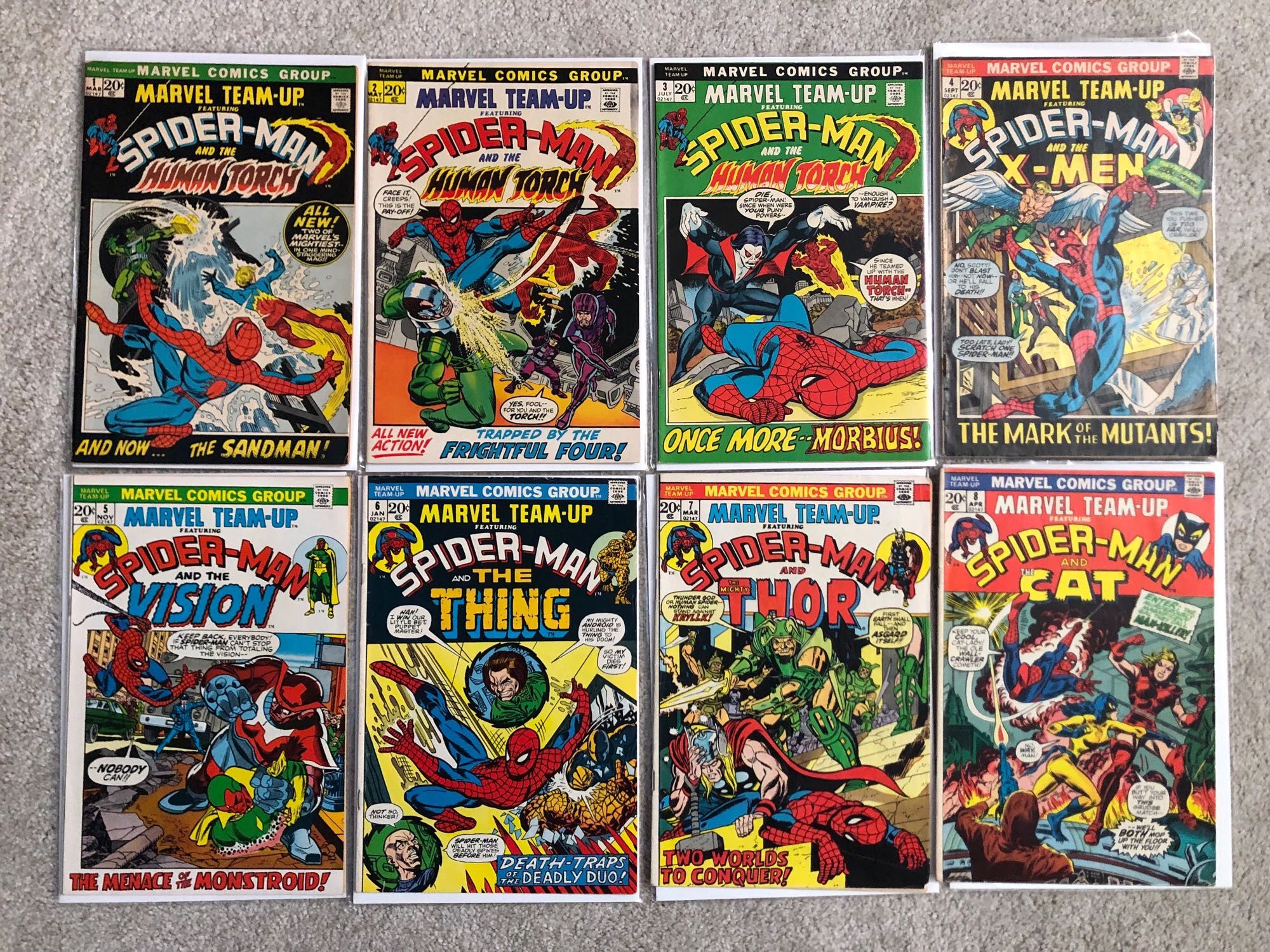 The first 8 issues of the comic Marvel Team-Up, showing Spider-Man teamed with with the Human Torch, X-Men, Vision, Thing, Thor and The Cat