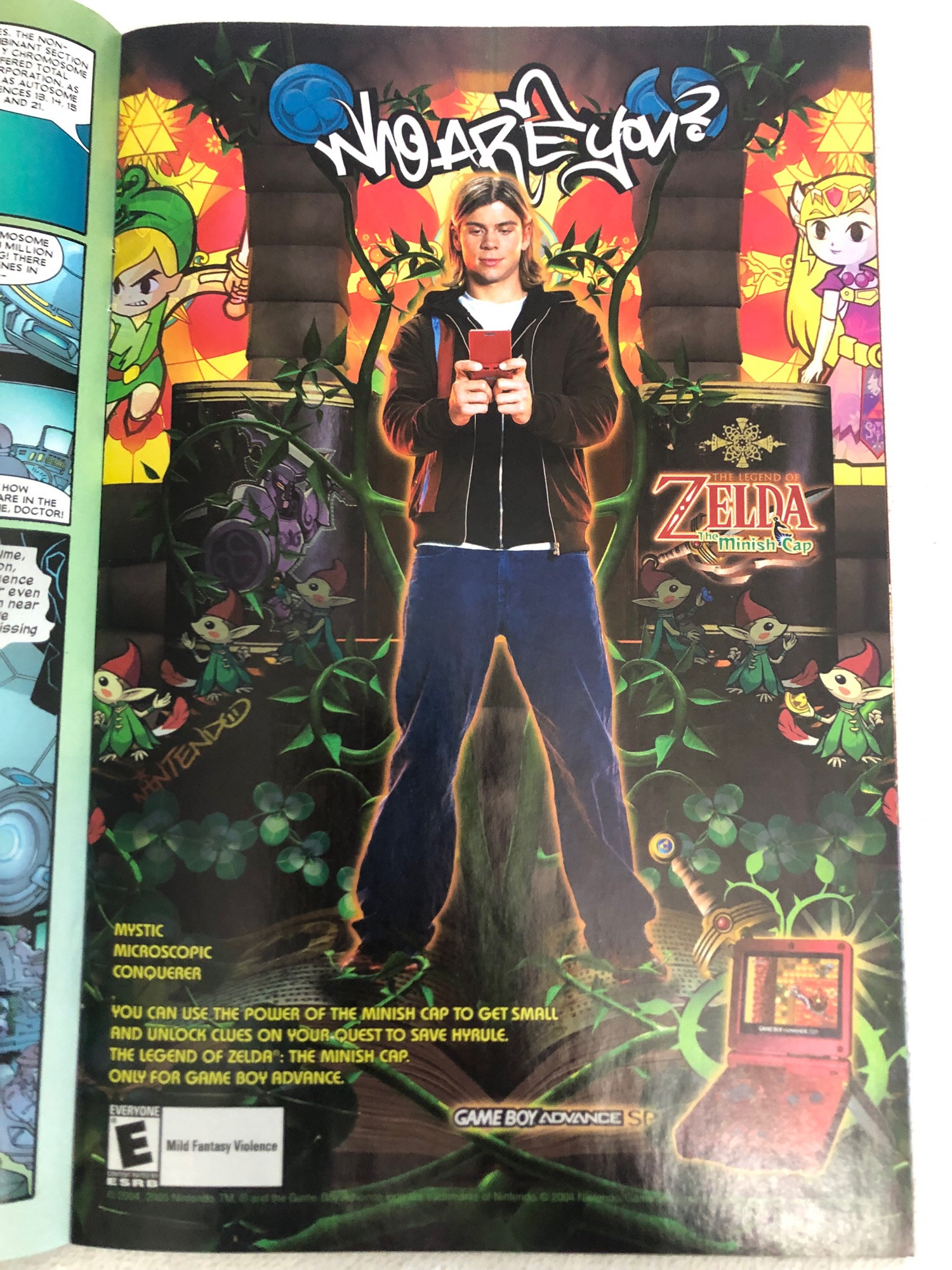 Ad in a comic for the Game Boy Advance game The Legend of Zelda: The Minish Cap. Shows someone standing and playing a Game Boy, in a drawn forest/jungle with some of the characters there. The tag line reads “Who are you?”