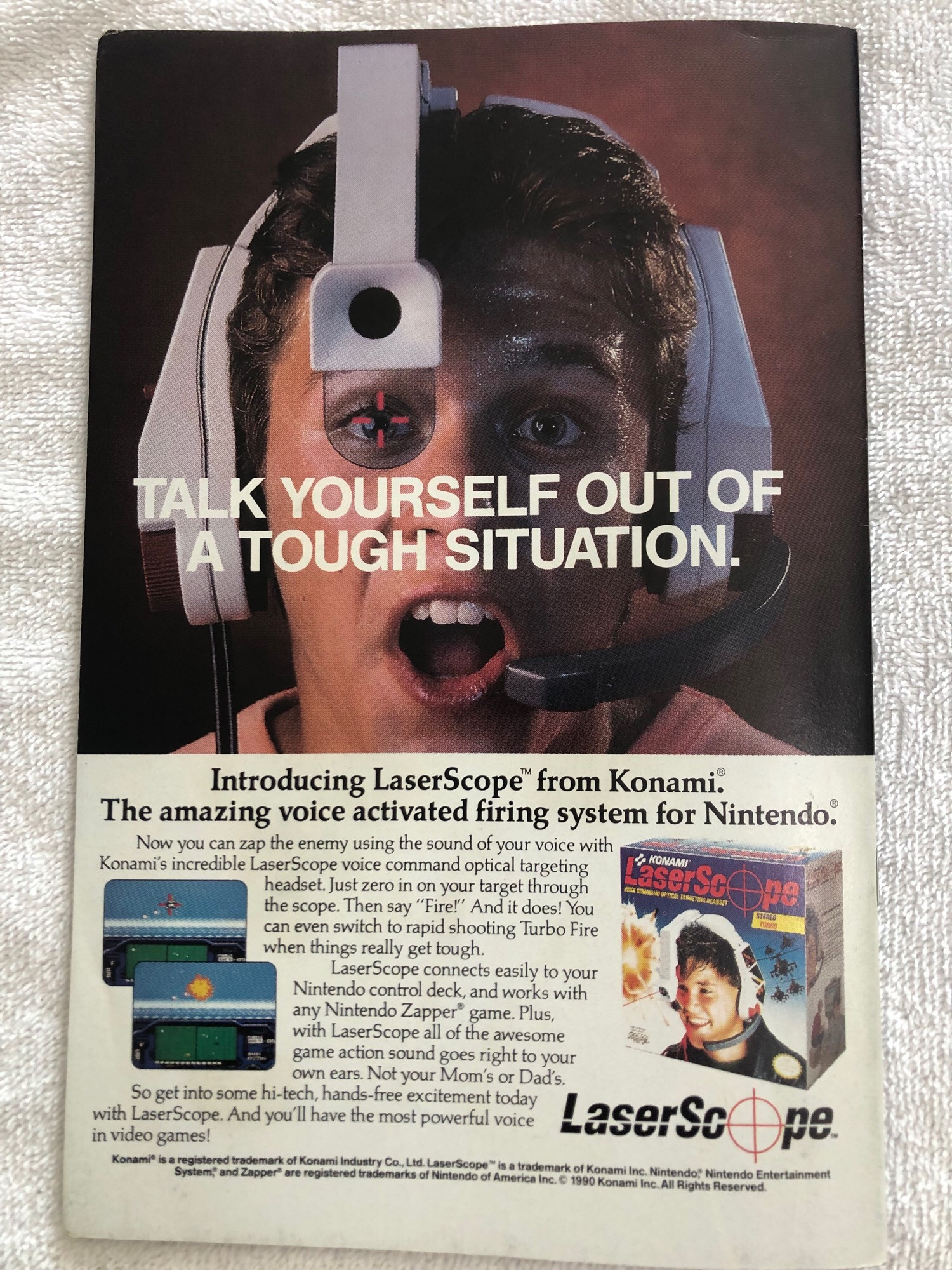 Back cover ad from Uncanny X-Men 272 (1991)

Shows a teen/kid’s head with a big plastic gaming headset on: has a humongous set of headphones, a big plastic mic to talk into, and a big plastic laser sighting scope over one eye. Kid is sweating, and maybe surprised or excited.

Says:
Talk yourself out of a tough situation.
Introducing LaserScope (TM) from Konami (R).
The amazing voice activated firing system for Nintendo (R).