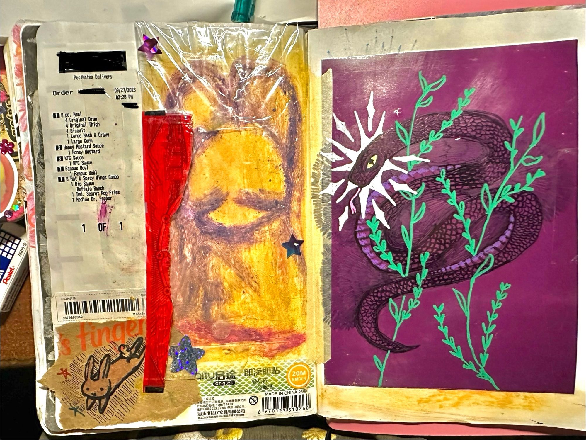 a sketchbook spread. on the left page is a food receipt, a strip of red plastic packaging, a Chinese packaging sticker, a brown paper bag with a hopping bunny drawn on it. There's a bunny drawn in purple with a yellow background beneath plastic packaging. There are 3 star stickers. On the right side of the page is a purple piece of paper. On it is a snake coiled around green sprigs. The snake has a yellow eye and a starburst halo around its head.