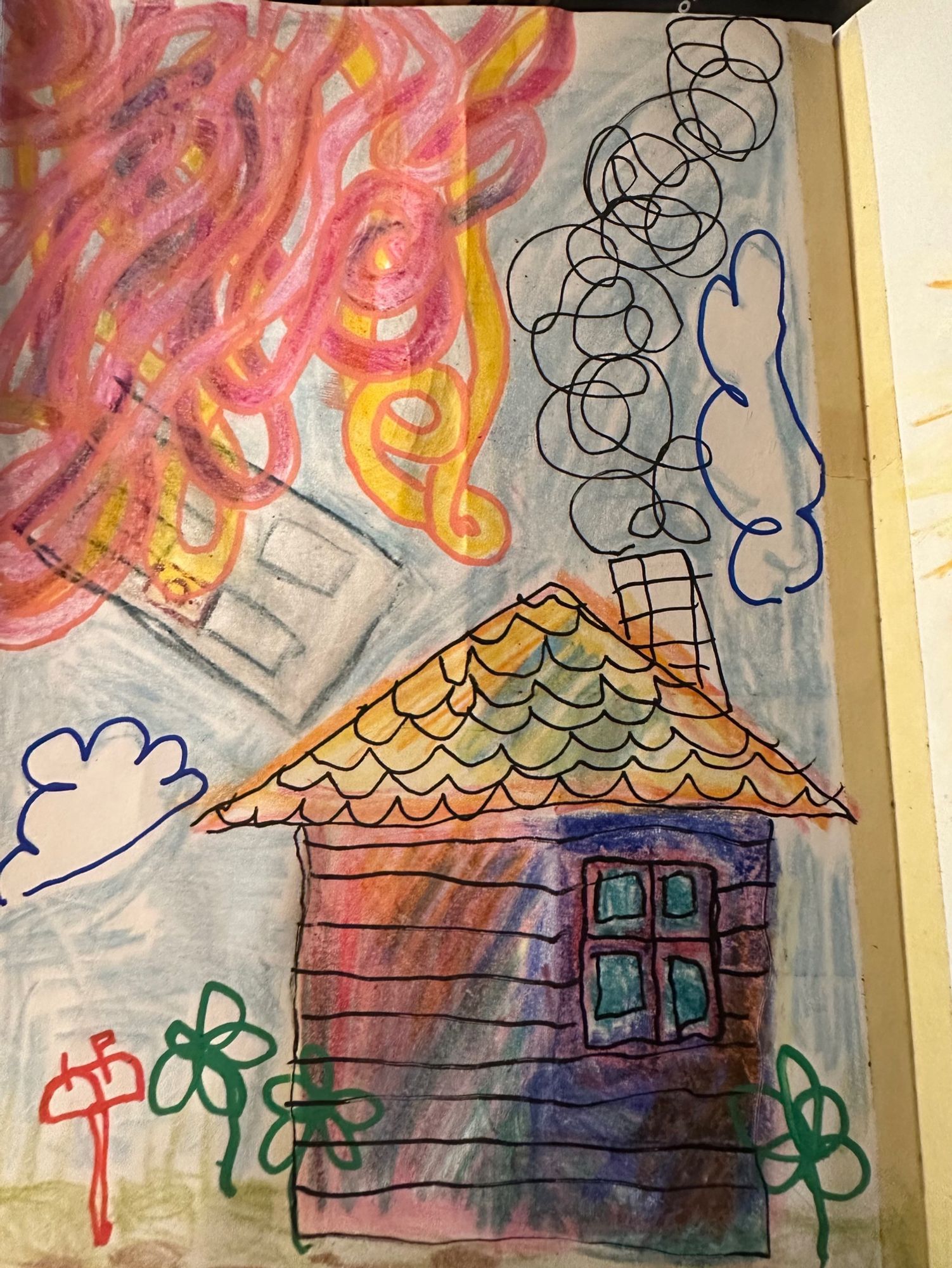 Childlike drawing of a house with a window and smoking chimney, but no door.  The house is colored in with red, orange, blue and greens in a chaotic way. The roof is scalloped and is orange yellow and blue. There are green flowers and a red mail box. A door floats above the house to the left and is eaten by a mass of pink, orange, and yellow squiggles. Two clouds are in the sky but they're crooked.