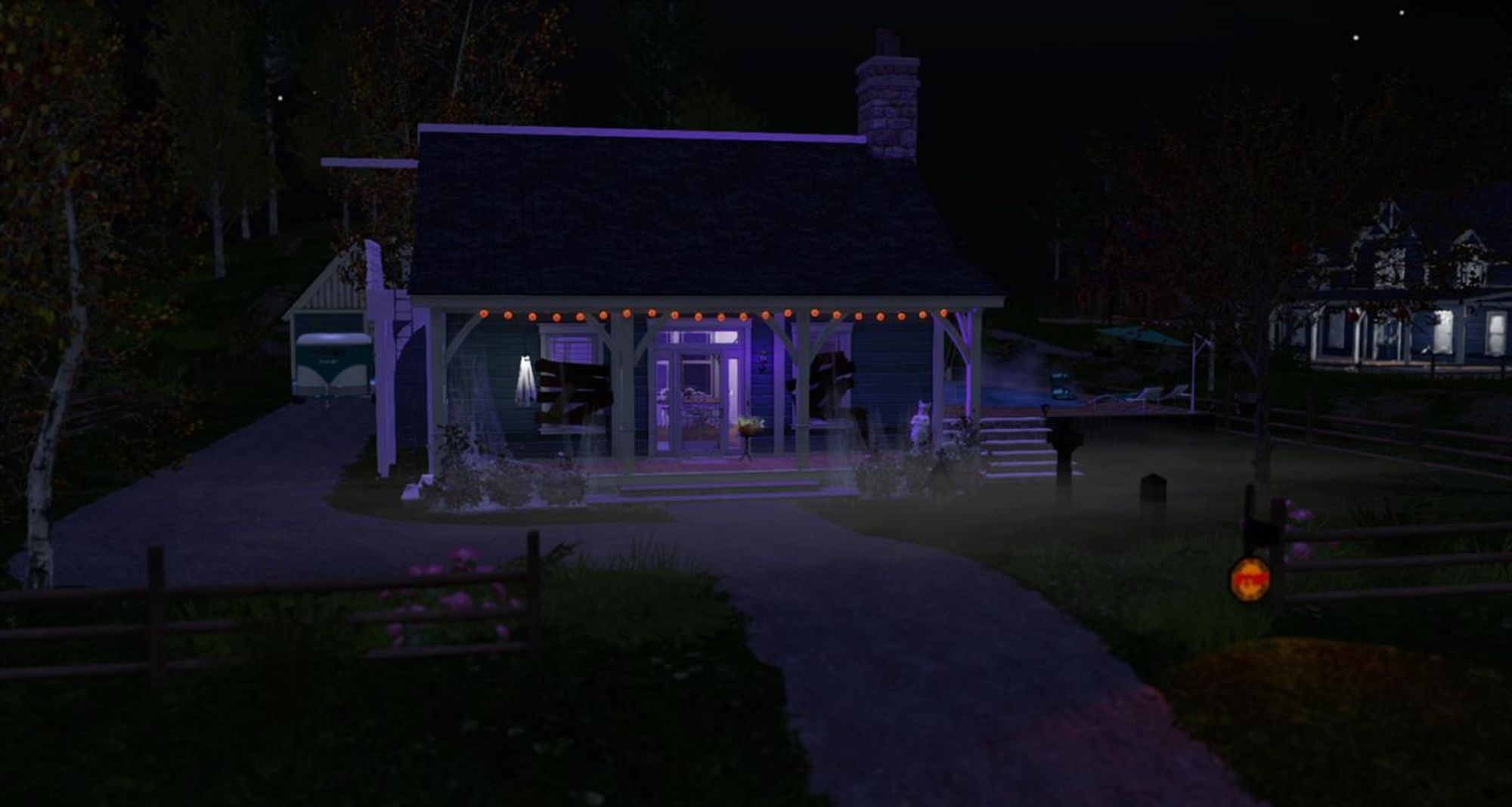 A screenshot of Ember's ranch home in Second Life at night with the porch festively decorated for Halloween.