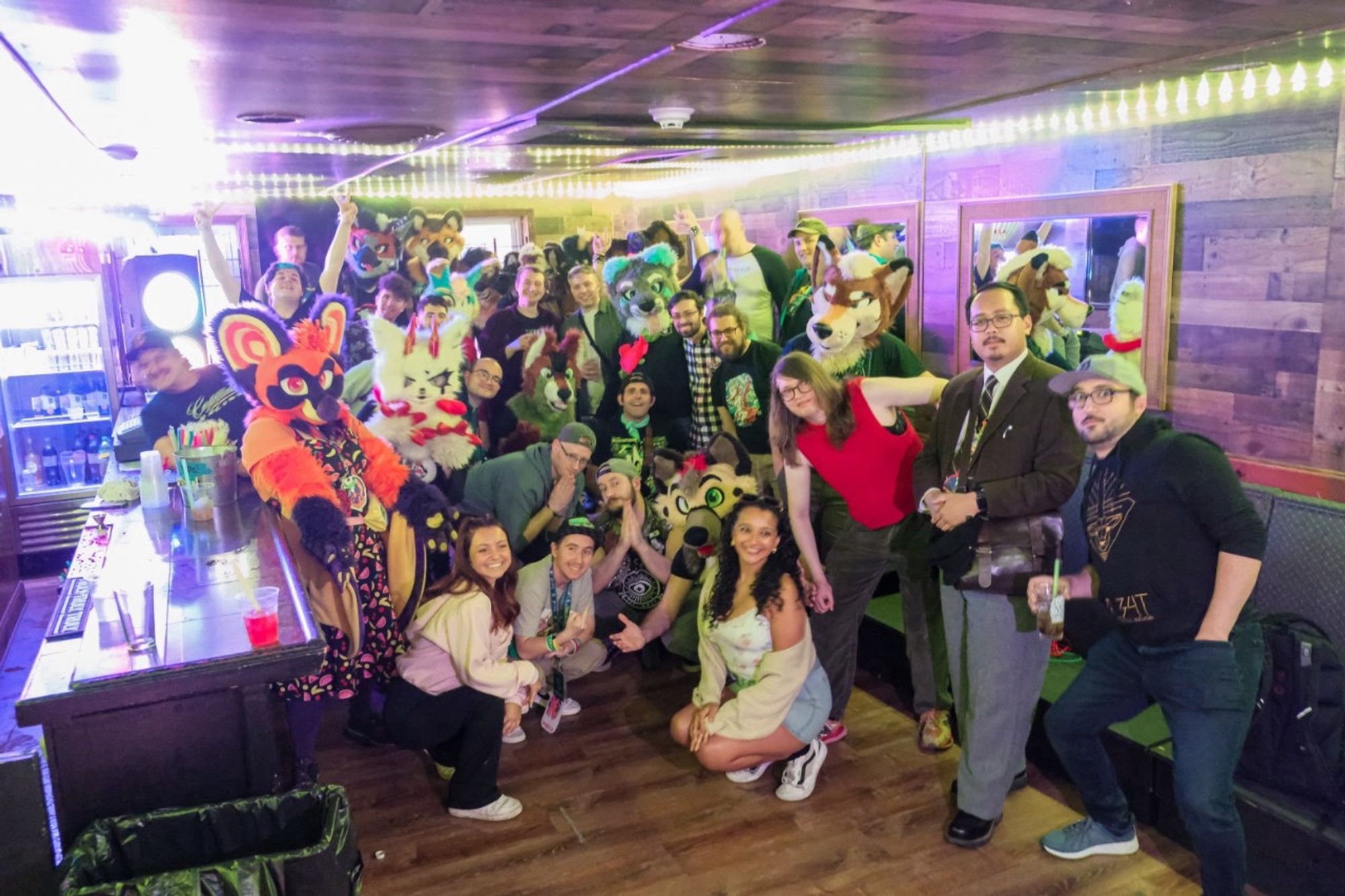 Group photo from the 2nd Manayunk Furry Bar Crawl. I am in the front with my black and green hat, giving an obscene gesture to the camera