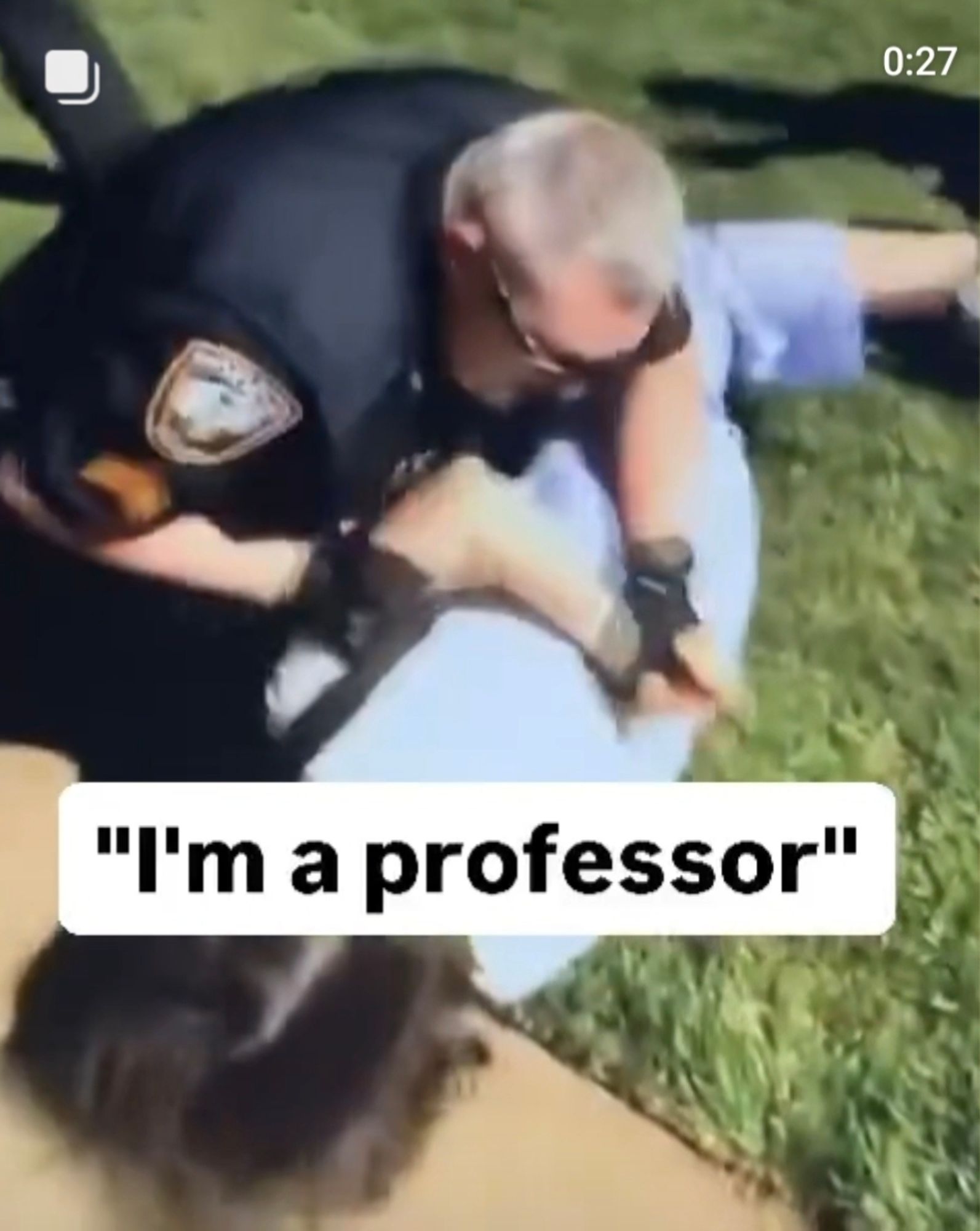 A professor being violently arrested