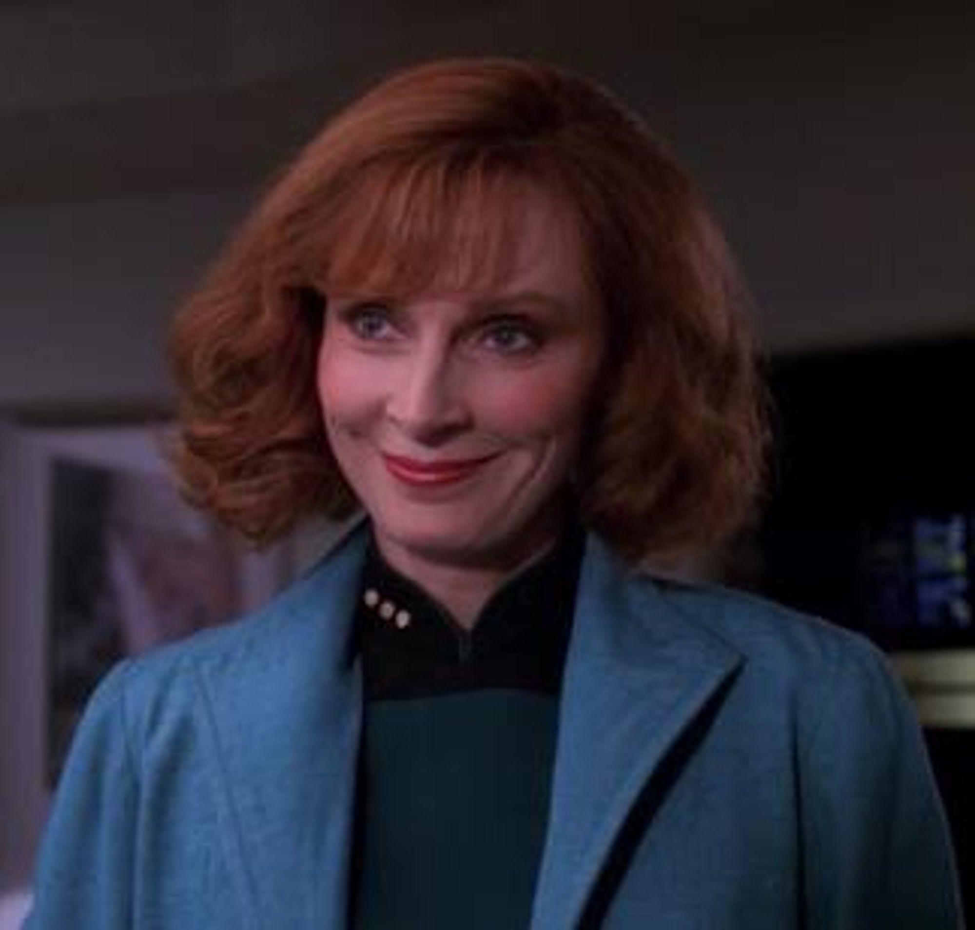 Beverly Crusher looking pleased.