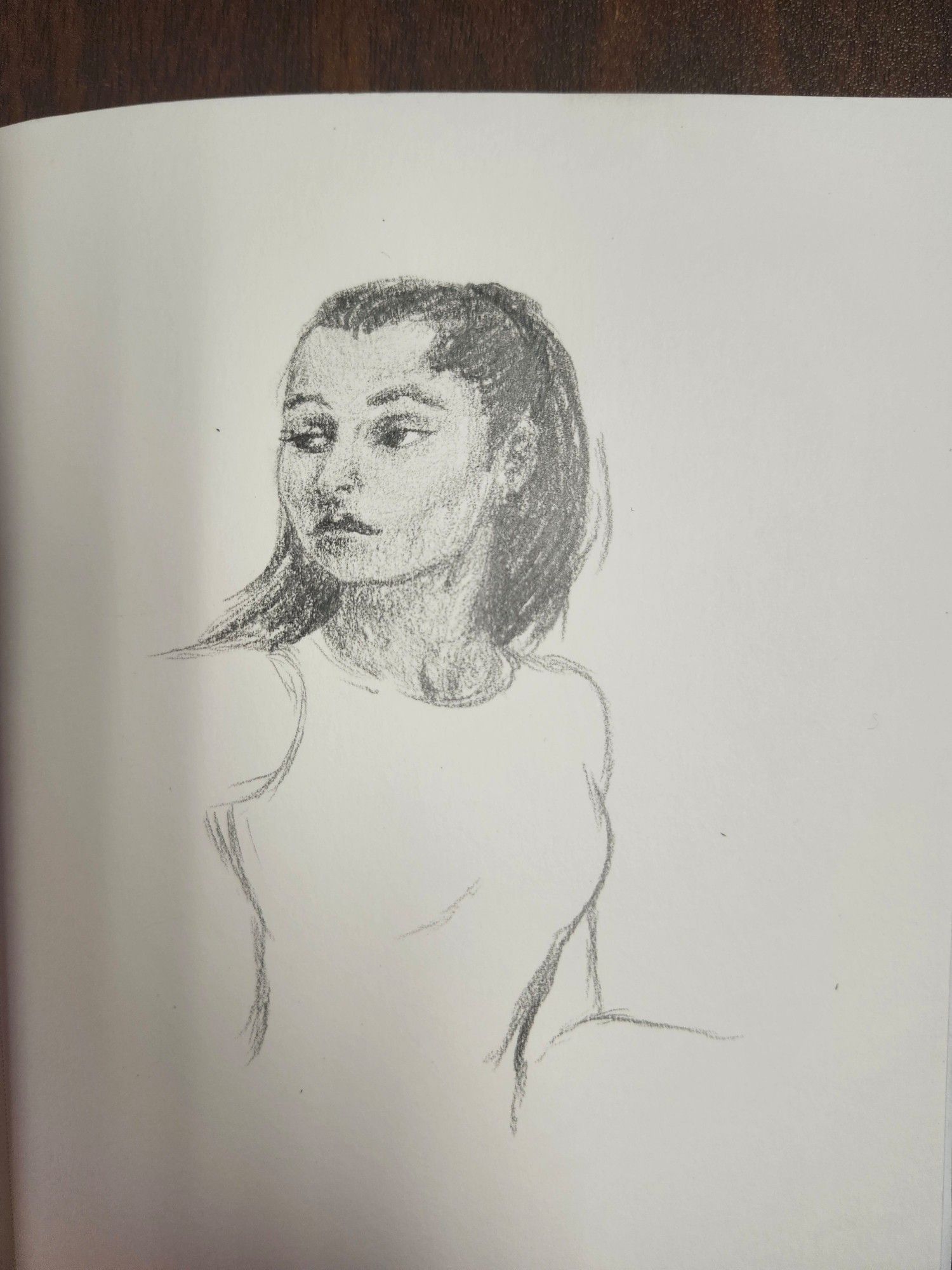 Pencil sketch. A dark skinned woman looking off to one side, unimpressed.