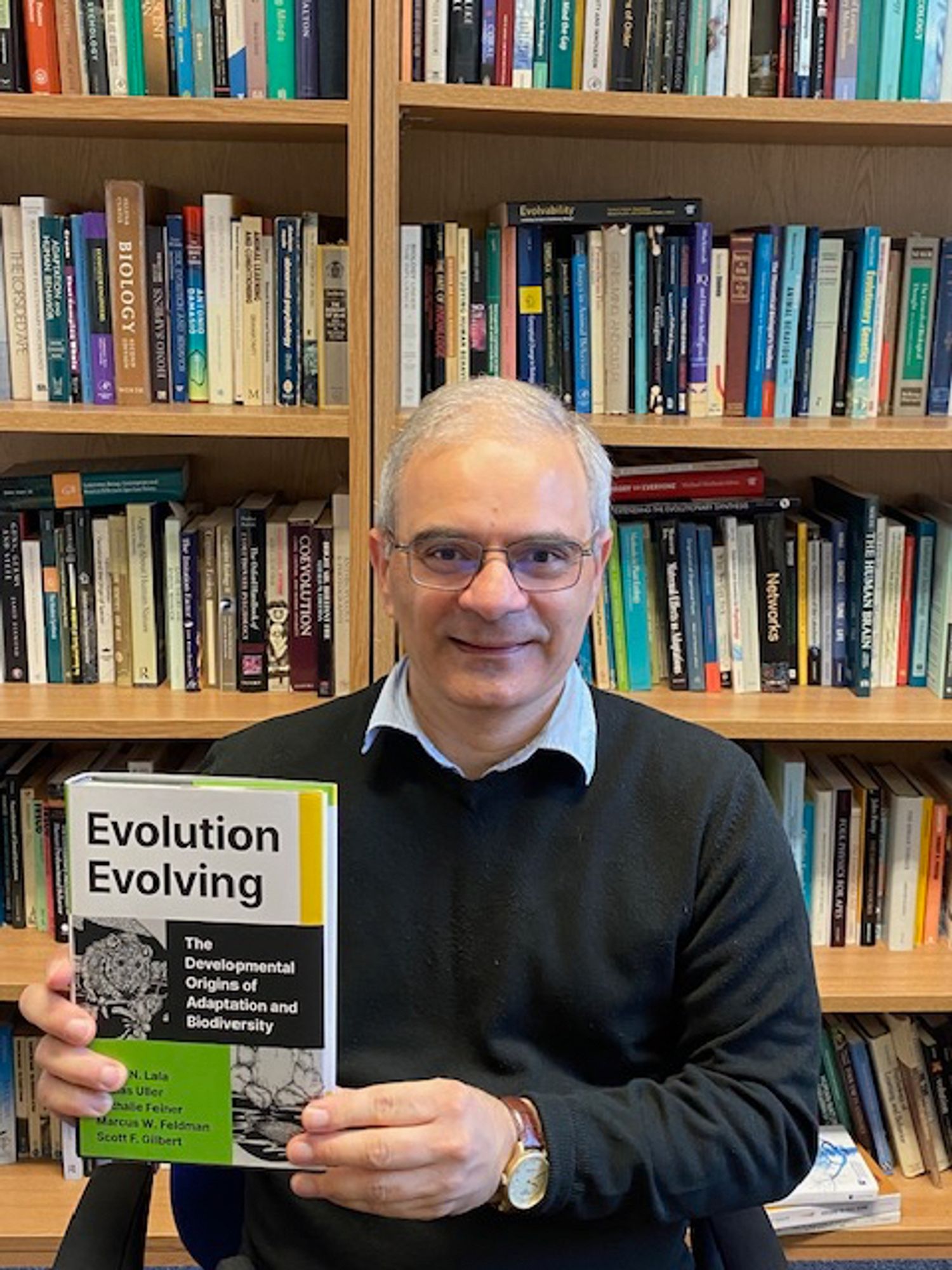 Kevin Lala with his new book "Evolution Evolving"