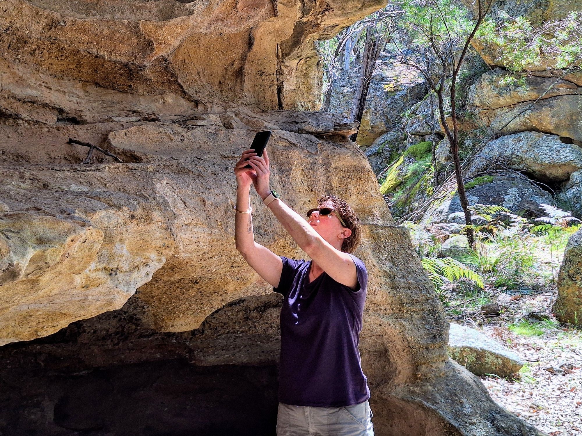 My travelling companion taking a photo of the stencil art