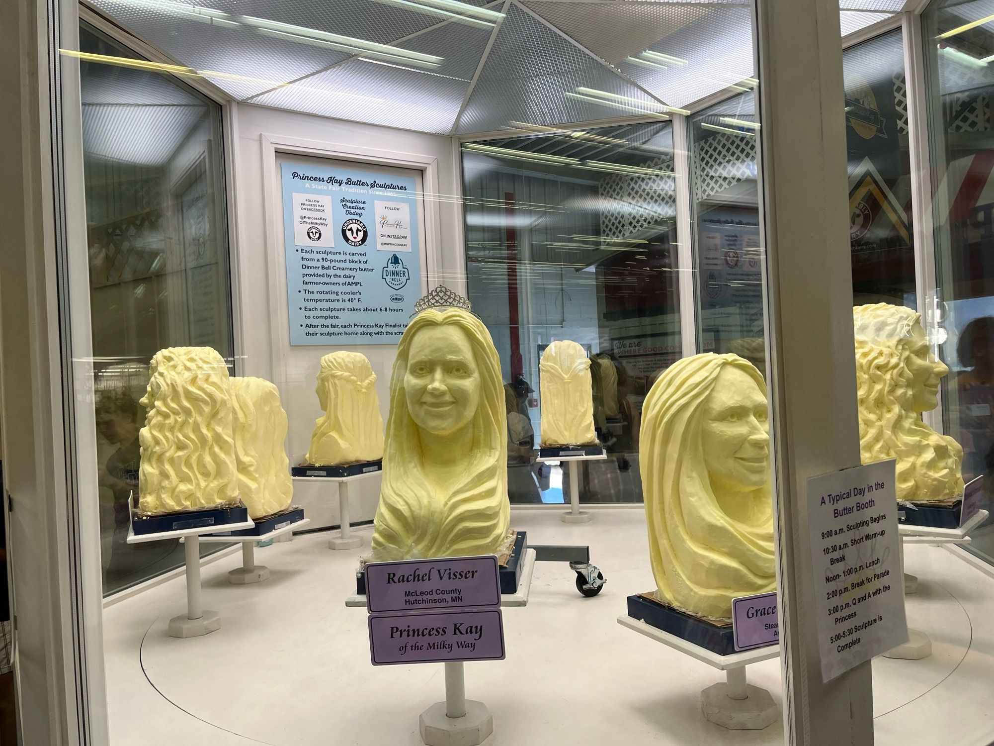 Butter sculptures, made on-site out of 90lb blocks of butter. A sign explains that the dairy princesses get to take their butter heads home to eat after the fair.