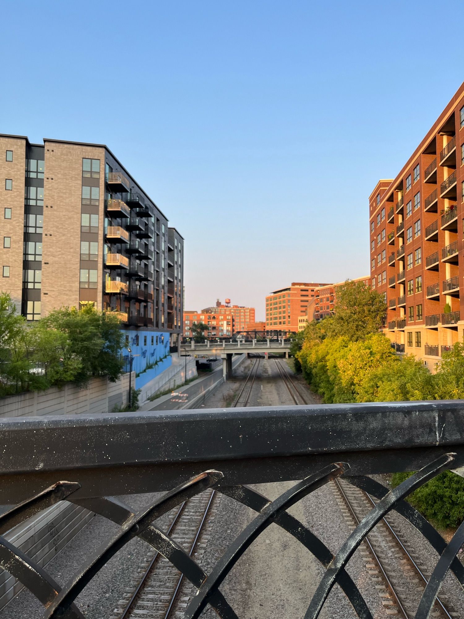 Minneapolis, north loop: bike path and train tracks and murals and warehouses and housing. Not burned down.