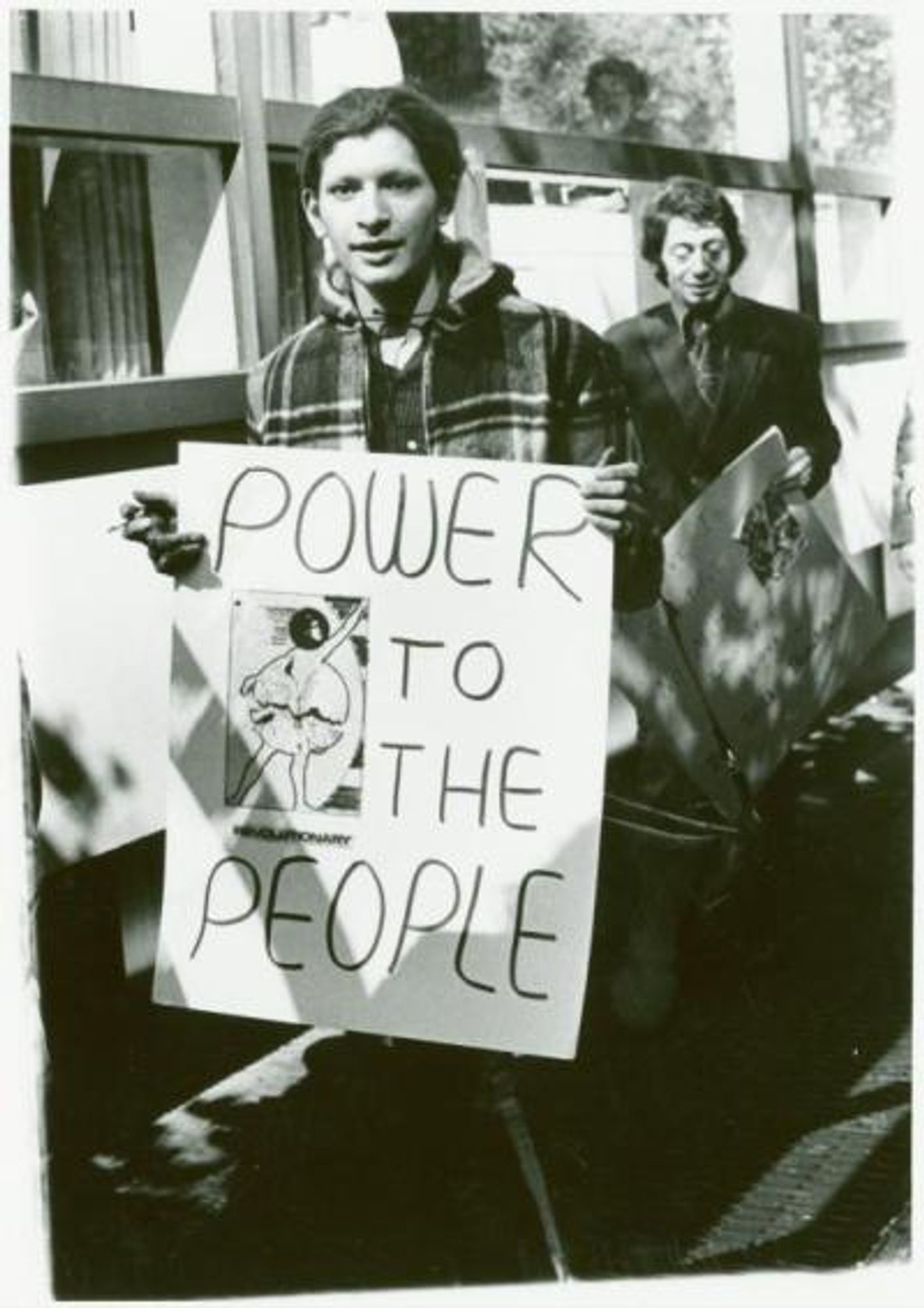 A young Sylvia Rivera holds a hand-made placard reading ‘POWER TO THE PEOPLE’