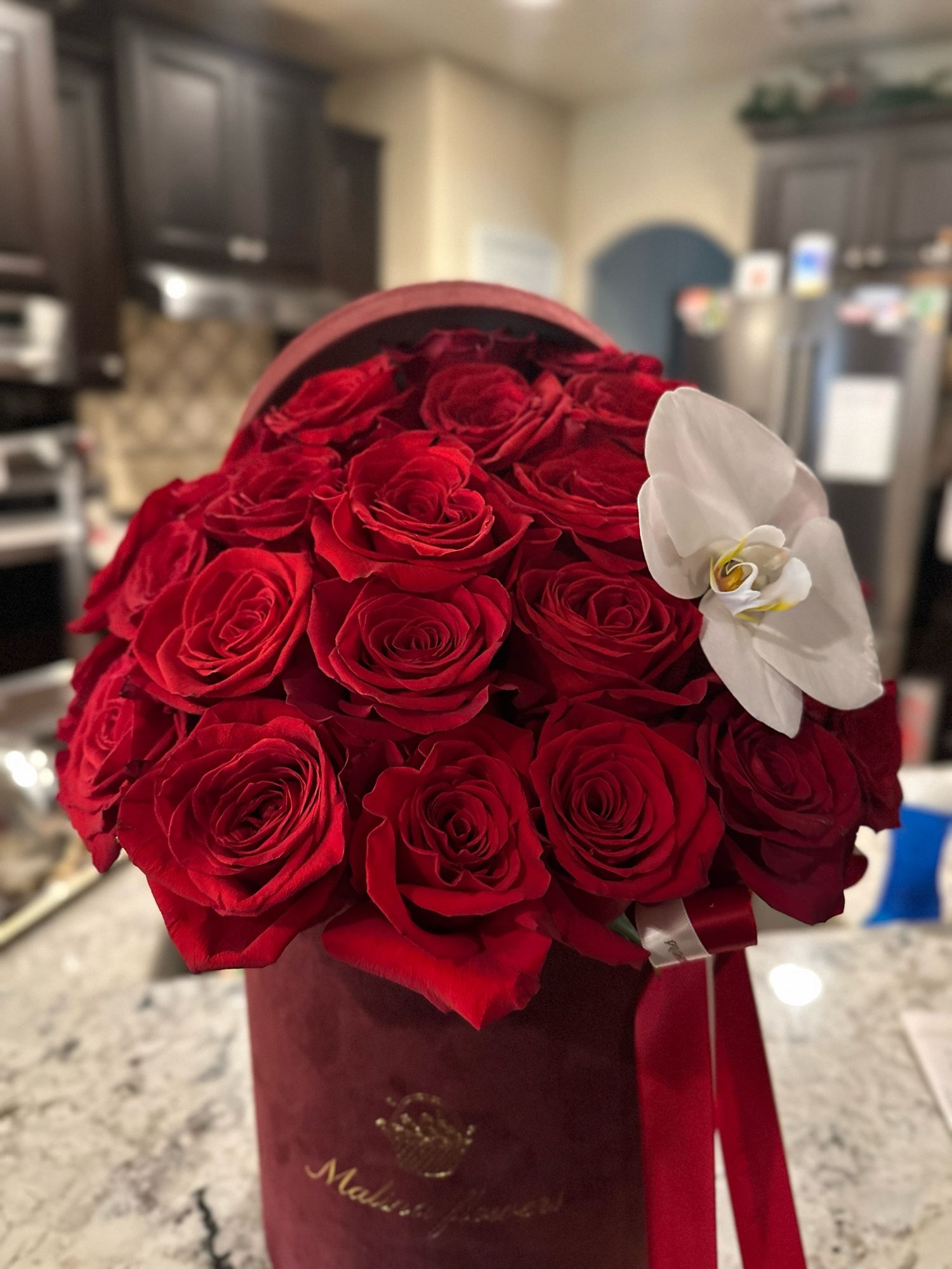 Roses in a maroon hat box