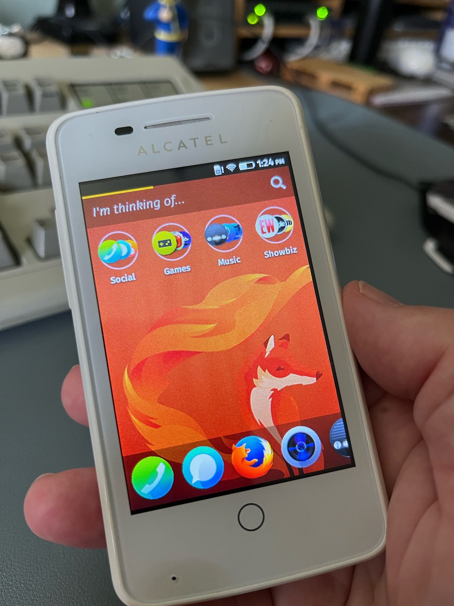 An Alcatel OneTouch phone in white, running Firefox as it’s operating system