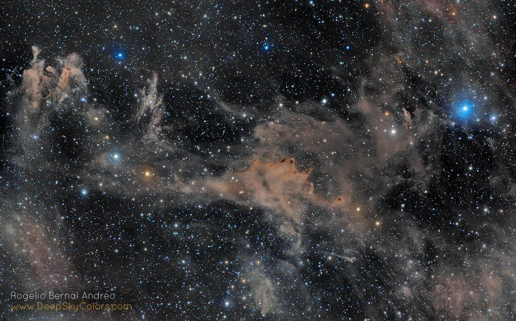 A mosaic image of a region in the northern sky, featuring dusty nebulae LBN762, LBN753, and LBN743, and the star Epsilon Arietis, all set against a backdrop of countless stars in the Milky Way. The image shows a vast expanse of cosmic dust and gas, highlighting the beauty and mystery of the universe.