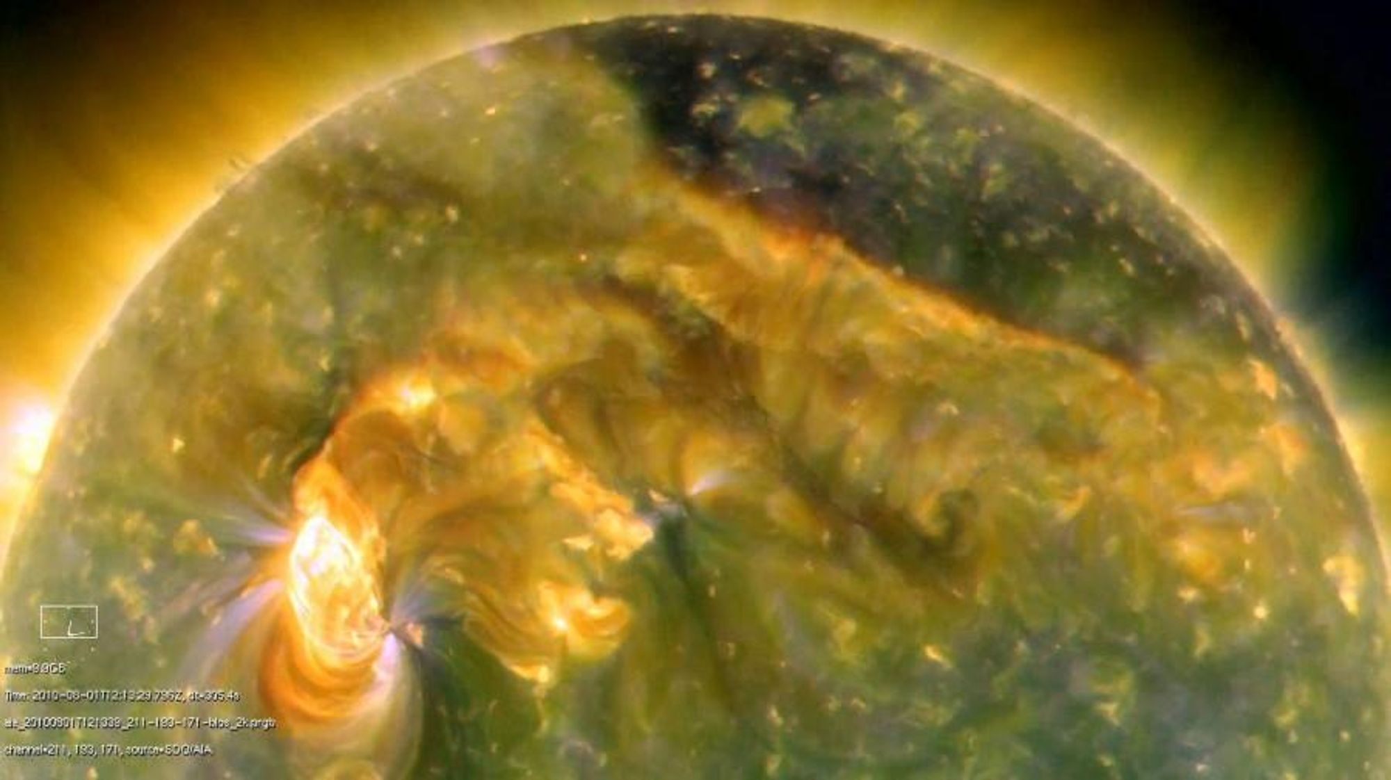 A false-color image from the Solar Dynamics Observatory showing a complex burst of activity playing across the Sun's northern hemisphere. The image shows hot solar plasma at temperatures ranging from 1 to 2 million kelvins. A small solar flare and a coronal mass ejection (CME) are visible, the CME impacting Earth's magnetosphere, triggering a geomagnetic storm and auroral displays.