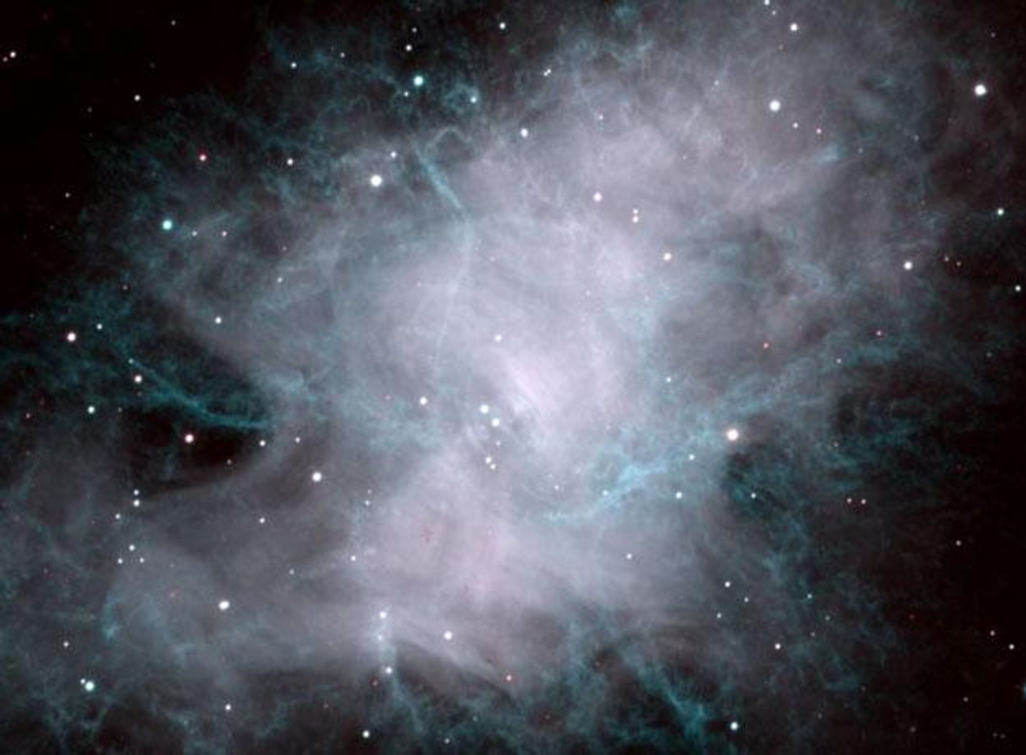 A two-color composite image of the Crab Nebula, a supernova remnant.  This image shows the filamentary structure of the nebula in great detail, with glowing hydrogen gas highlighted in blue and red.  The nebula's center contains a dense neutron star, a pulsar that spins thirty times a second.  This pulsar powers the nebula's expansion.  This image was taken with the WIYN 3.5-meter telescope.