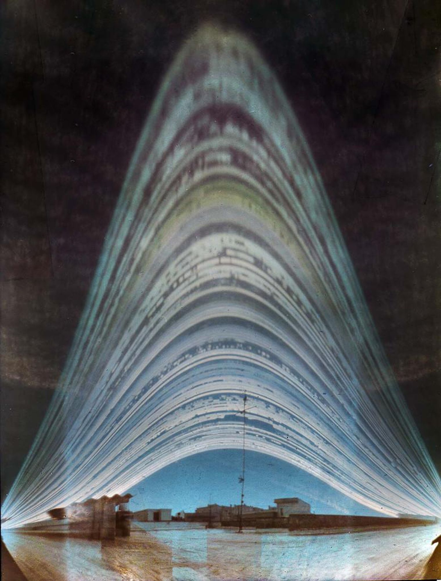 A solargraph captured in Casarano, Italy, showing the Sun's path across the sky from December 21, 2018 to June 16, 2019. The image was created using a pinhole camera and photographic paper. The Sun's path is shown as a series of arcs, with breaks and gaps caused by cloud cover. The image is a beautiful example of the power of long-exposure photography to capture the movement of the Sun over time.