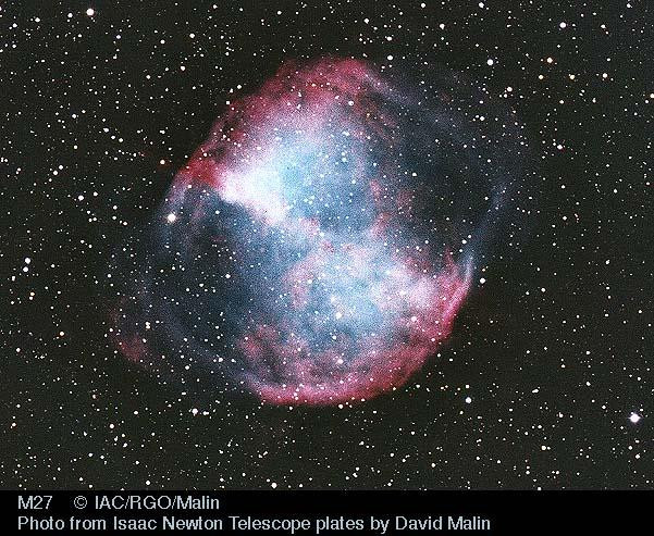 A stunning image of the Dumbbell Nebula (M27) in the constellation Vulpecula. This planetary nebula is a glimpse into the future of our Sun, showcasing the fate of stars like ours when their nuclear fusion stops.  It's one of the brightest planetary nebulae, visible even with binoculars. The image reveals the nebula's intricate structure, featuring a bright, bluish core and a fainter, reddish halo. The image highlights the beauty and complexity of deep-space objects and inspires wonder about the universe's vastness.