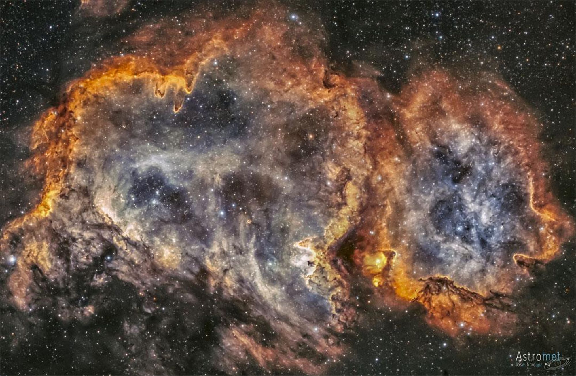 A colorful composite image of the Soul Nebula (W5) in Cassiopeia. The nebula, also known as the "Soul of the Queen of Aethopia", is home to several open star clusters, dark ridges and pillars, and vast bubbles sculpted by stellar winds. Located about 6,500 light years away, this nebula spans about 100 light years.