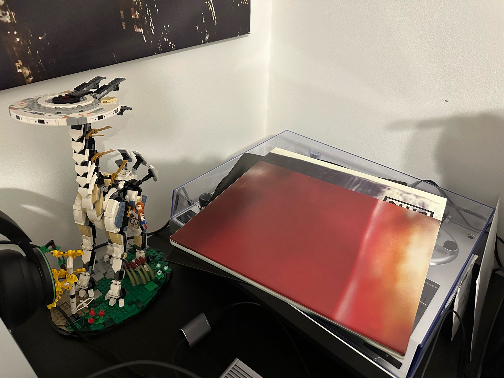 A vinyl copy of Nine Inch Nails’ album The Fragile. Also LEGO Horizon Tallneck!