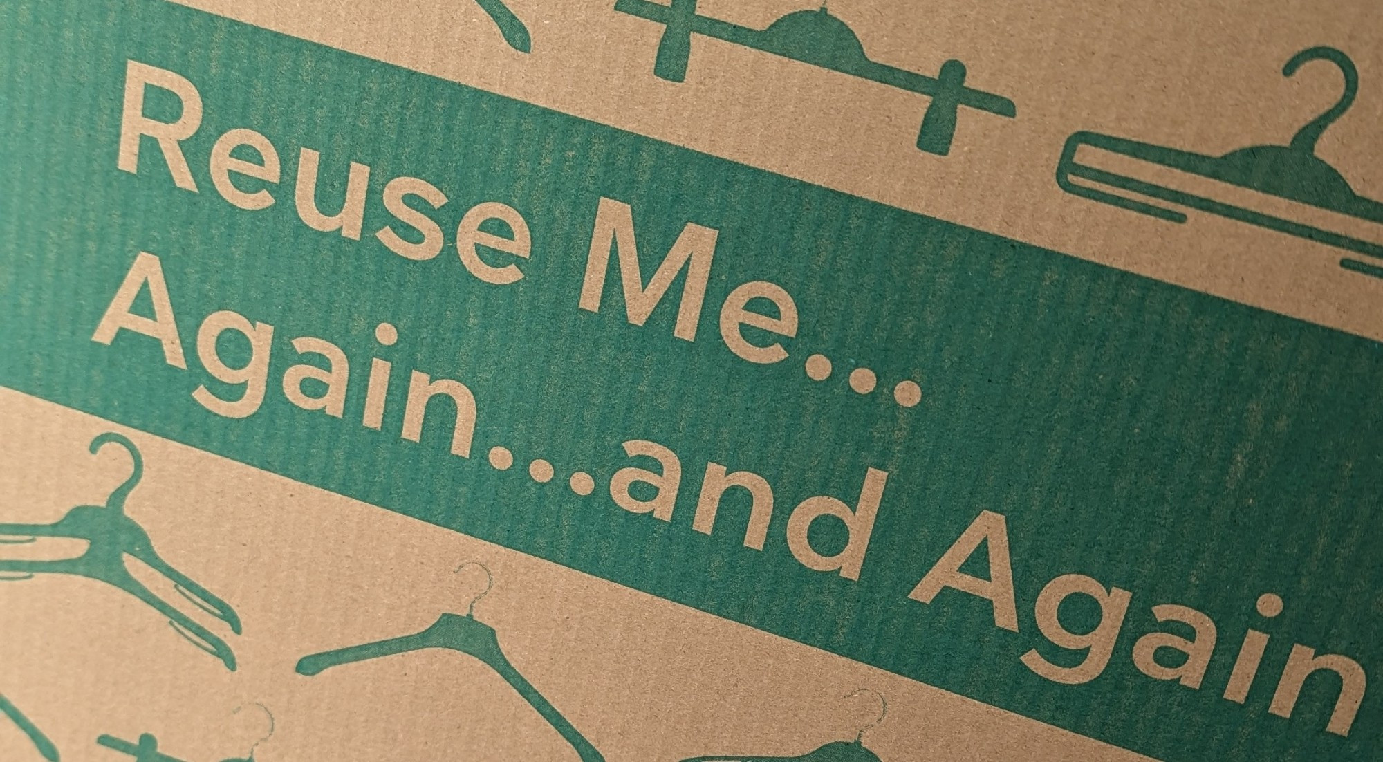 cardboard box that says "Reuse Me... Again...and Again"