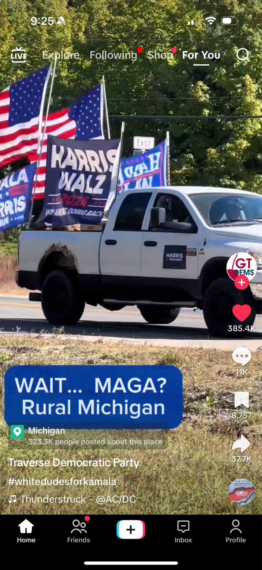 A white pickup truck decked out in Harris/Walz flags