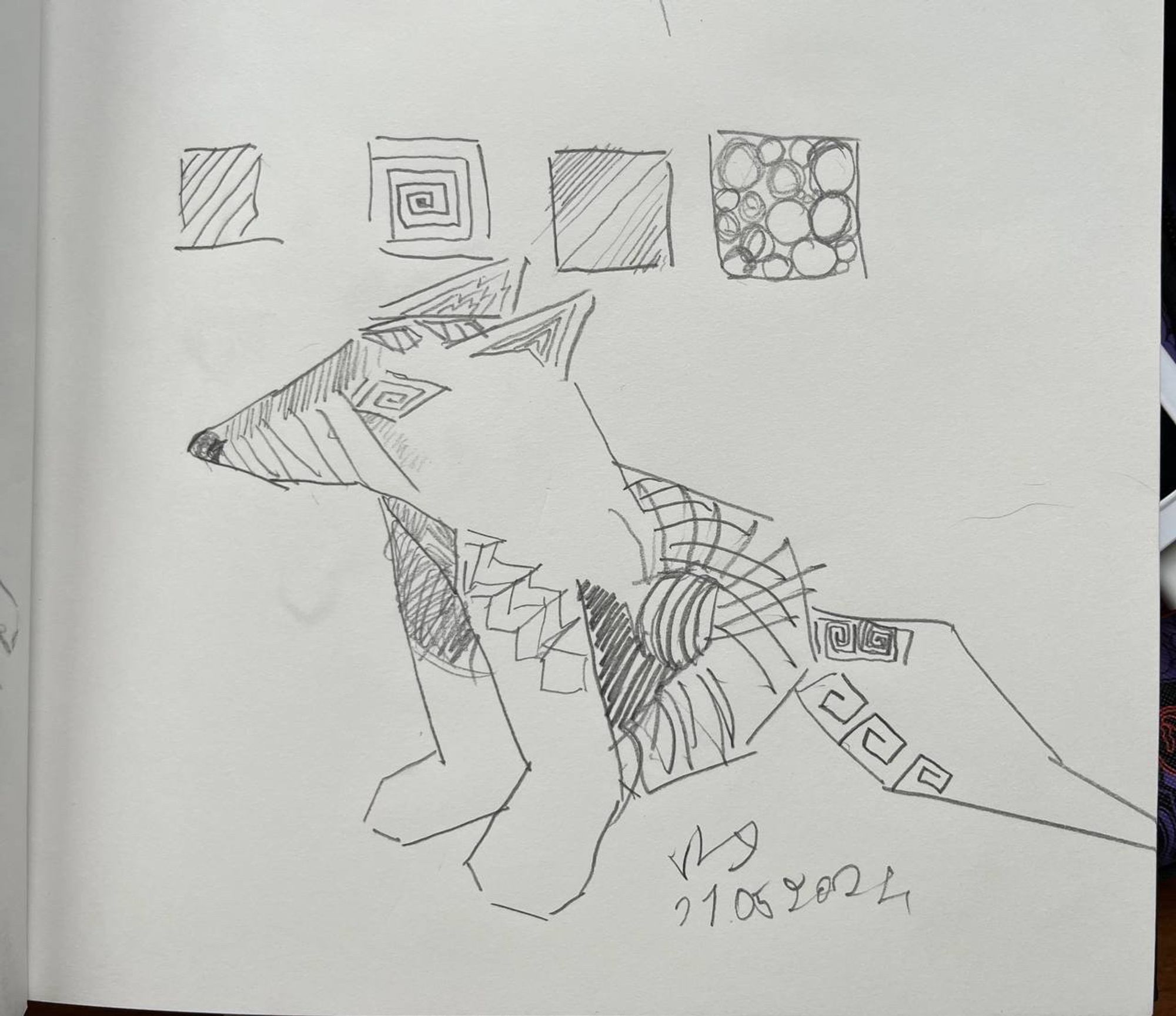 A traditional pencil sketch of 4 squares filled with patterns. Under it is an attempt sketch to fill the entire fox shaped creature with patterns.