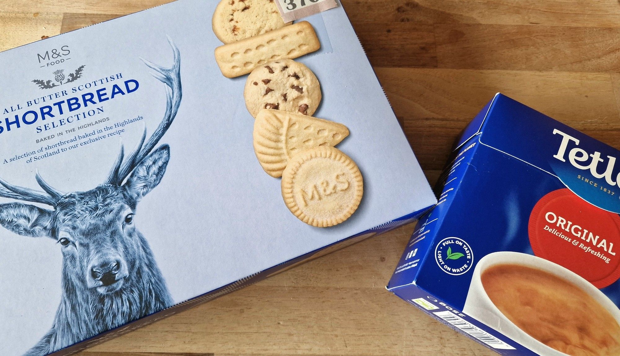 Image shows a box of shortbread biscuits and a box of tea on a kitchen worktop.