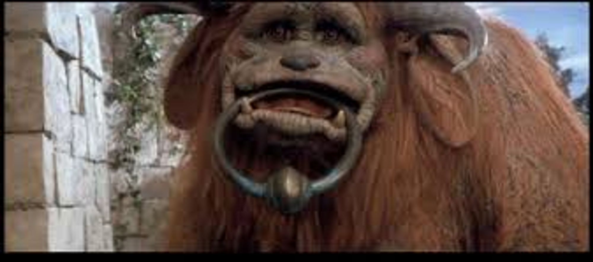 Ludo from Labyrinth with the doorknocker ring in his mouth