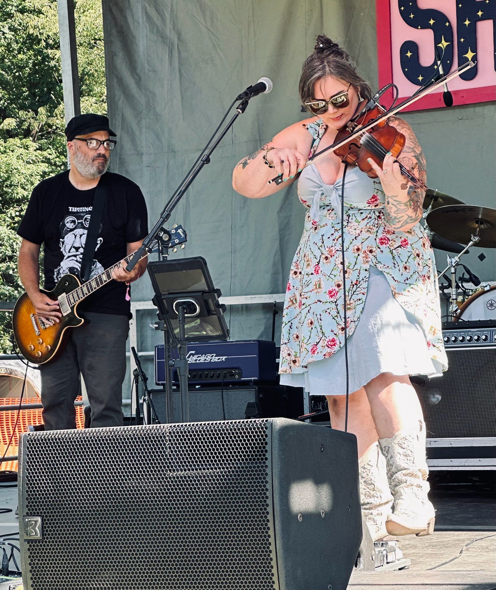 From left: man playing guitar, Allie Kral playing fiddle.