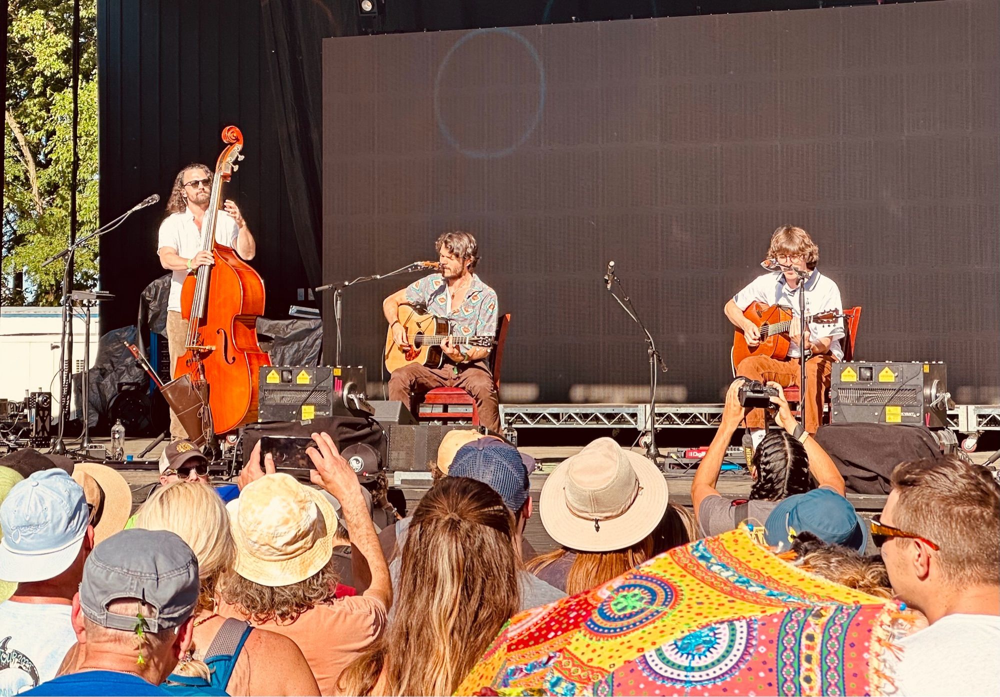 Trio of acoustic players: from left upright bass and two guitar players