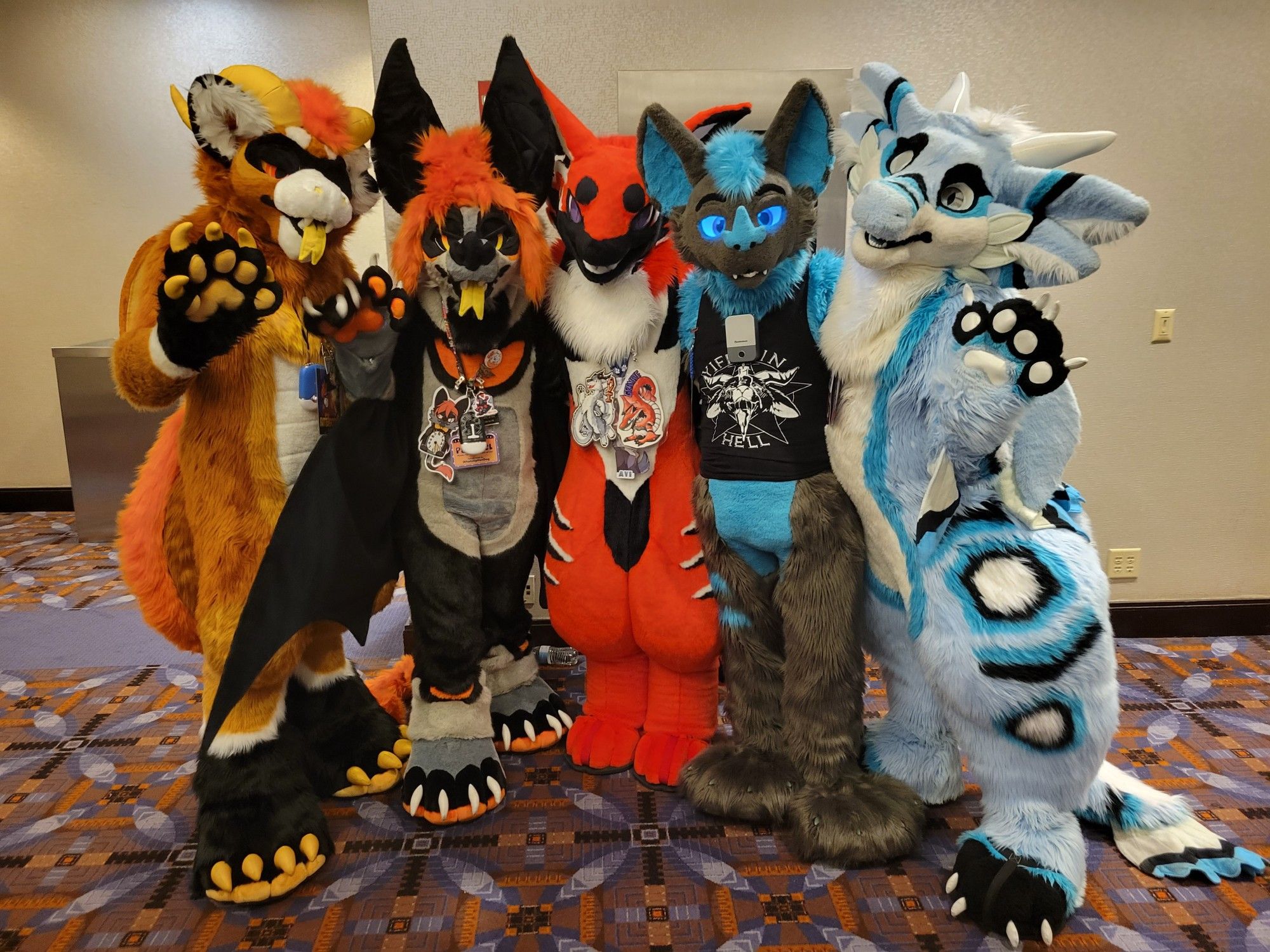 Group of fursuiters together posing, amazing floof beans <3