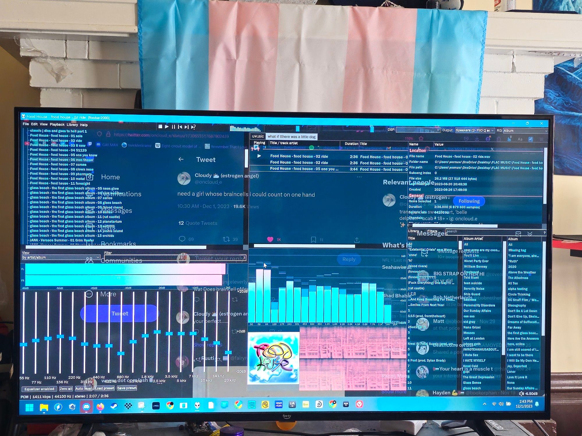 photo of my trans pride themed foobar setup listening to food house with a trans flag behind the tv screen